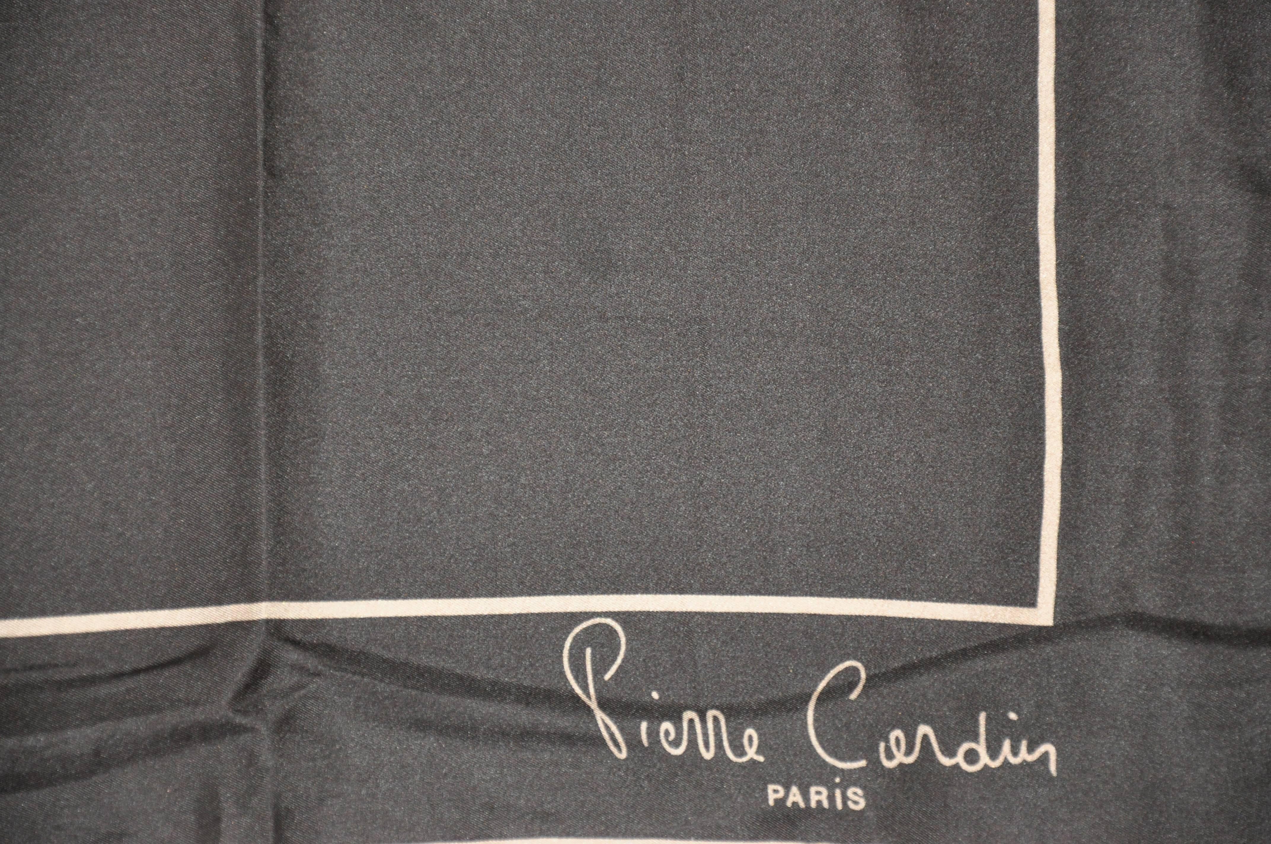        Pierre Cardin signature taupe and coco-brown silk scarf accented with hand-rolled edges, measures 18 1/2 inches by 18 1/2 inches. Made in France. 