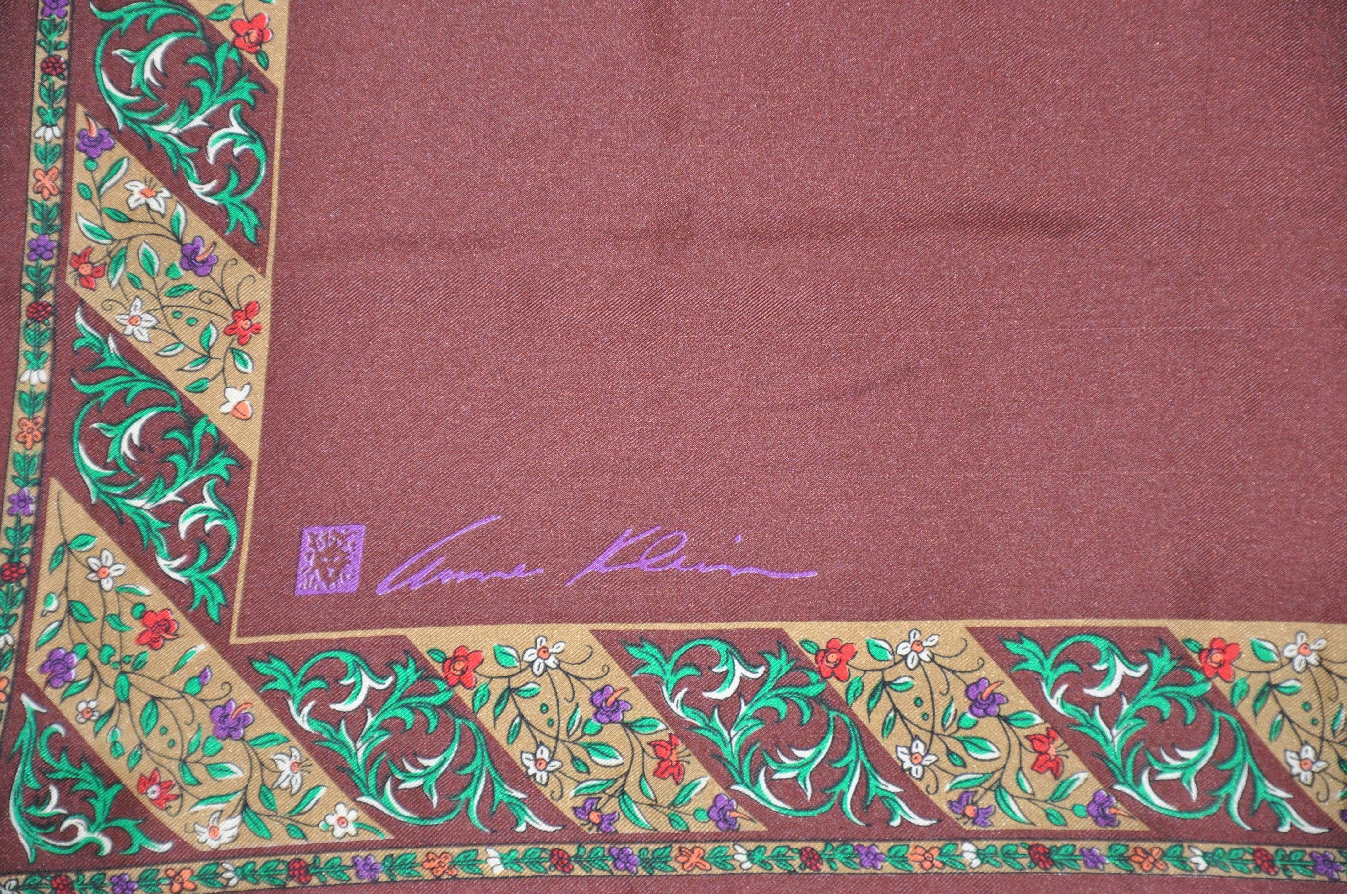        Anne Klein coco-brown silk scarf accented with multi-floral border and finished with hand-rolled edges. Scarf measures 21 inches by 21 inches of silk, and made in Japan.