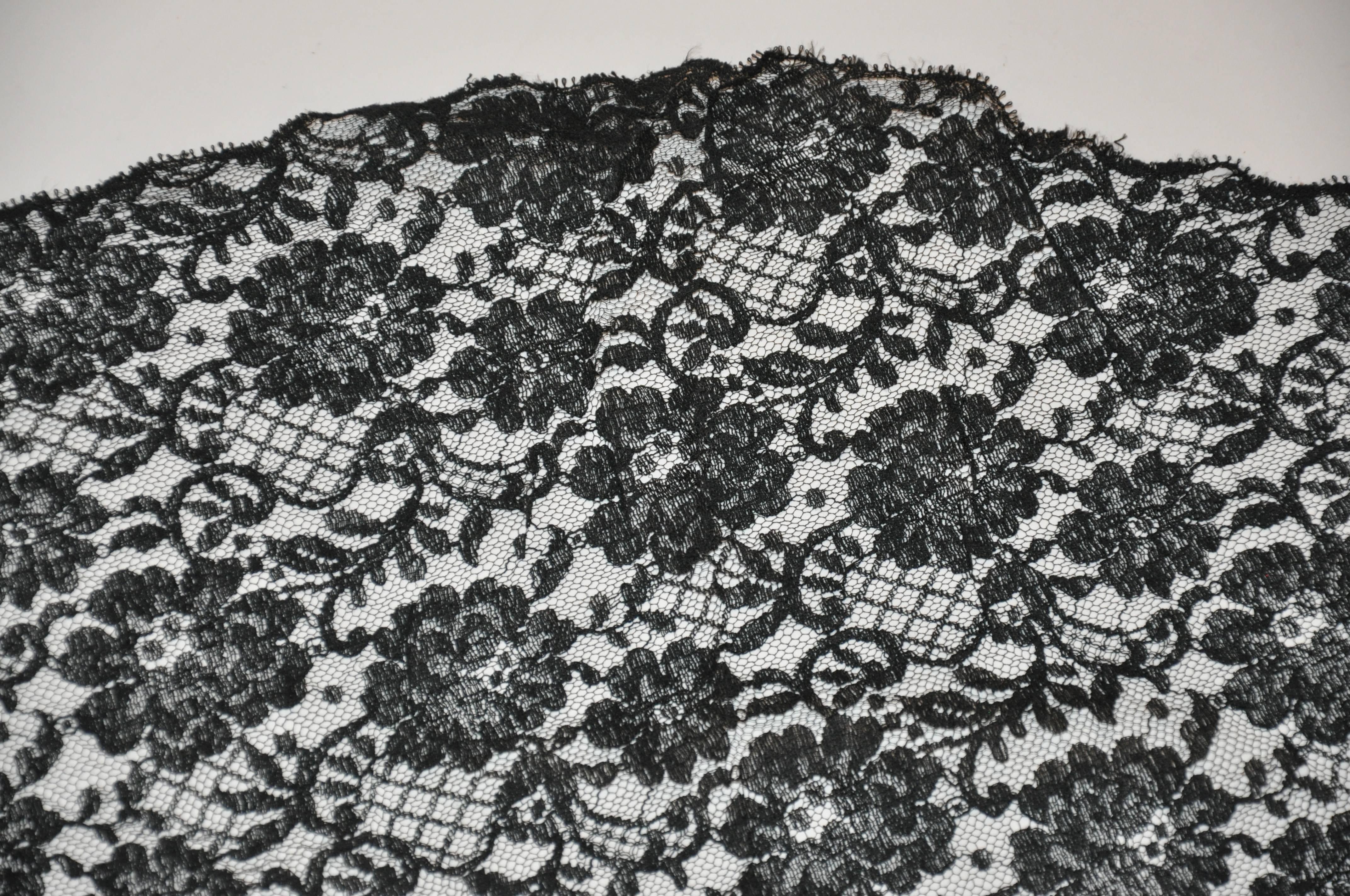        Elegant and timeless, this black Swiss lace 