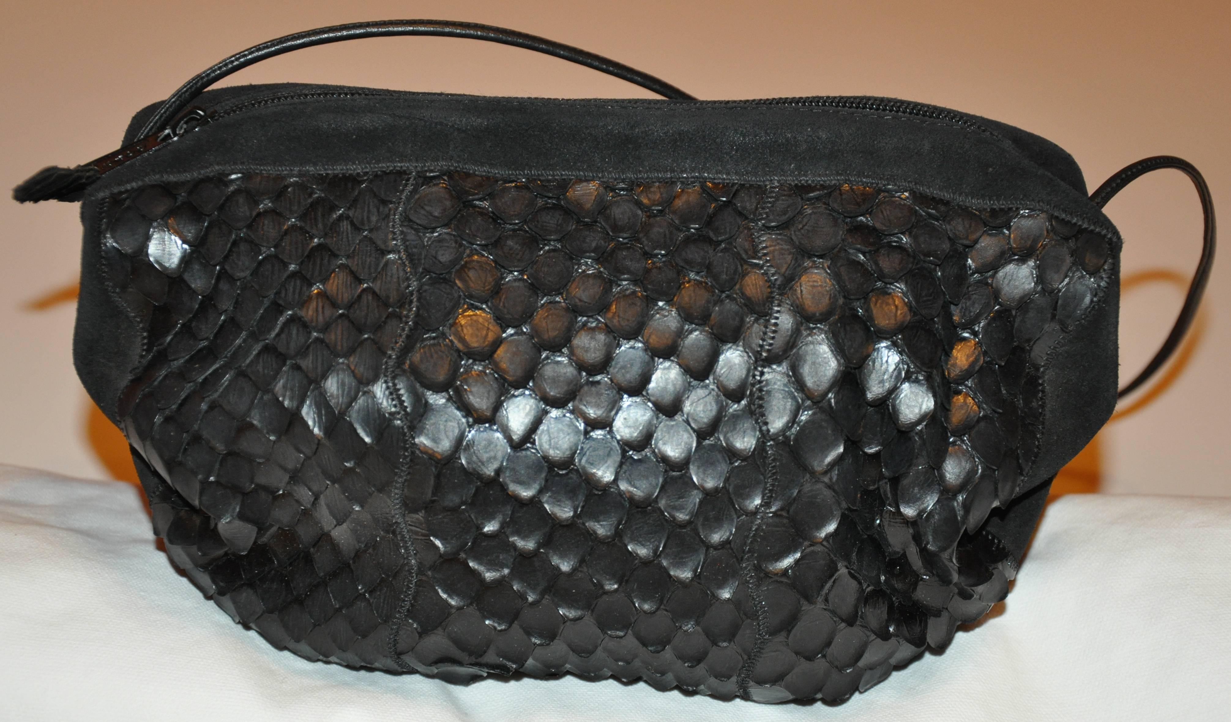        Carlo Falchi wonderful soft black suede shoulder bag accented with soft crocodile-skin. The interior is accented with black silk. The shoulder strap is of calfskin and stands at 12 inches in height. The length across measures 10 1/2 inches.