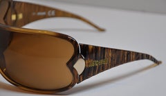 Roberto Cavalli Gafas de sol curvadas de lucita grabada en marrón dorado audaz
