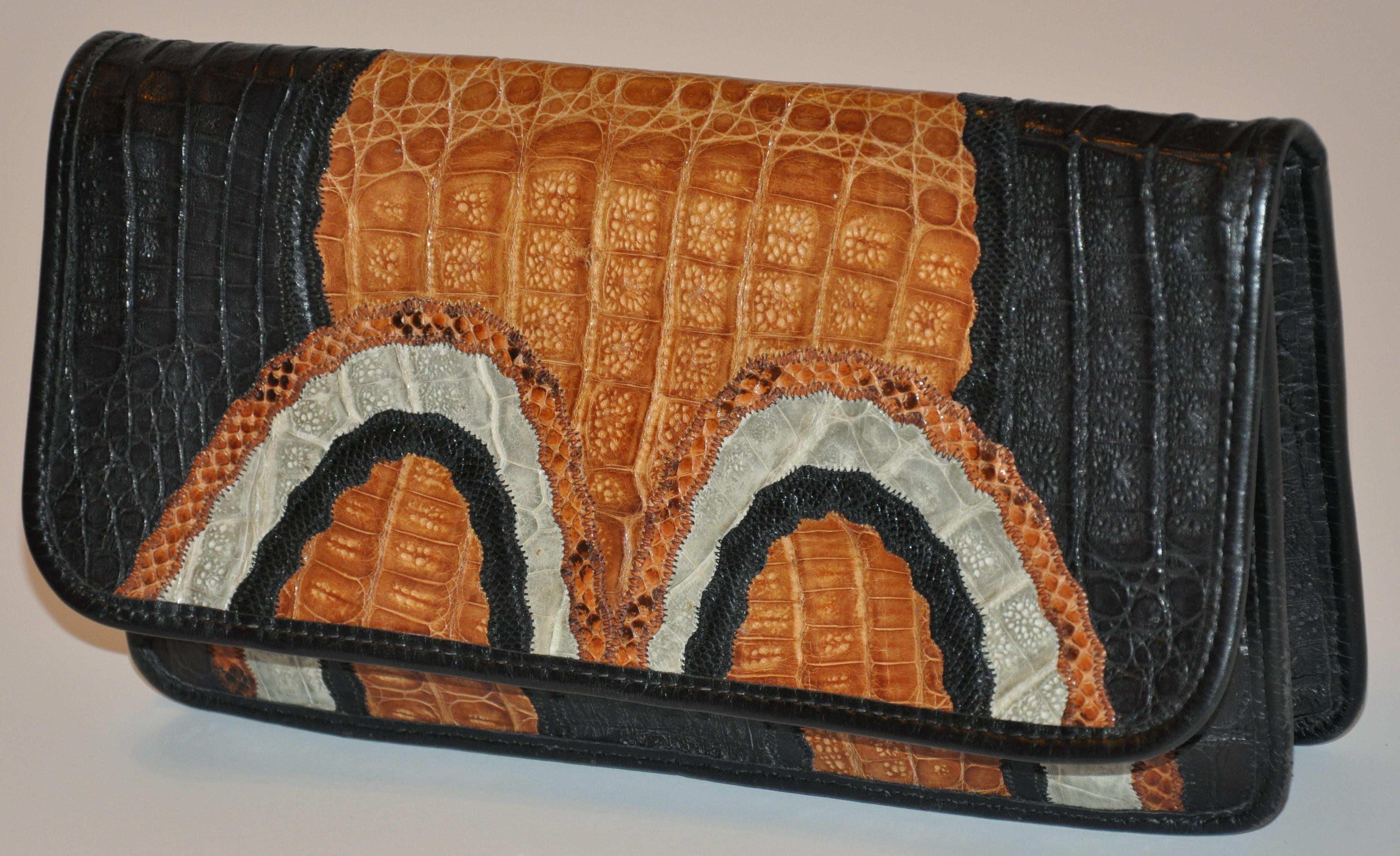        Carlos Falchi wonderfully detailed multi-color clutch and optional shoulder bag accented with Pylon, snake, crocodile and alligator skins into a wonderful 