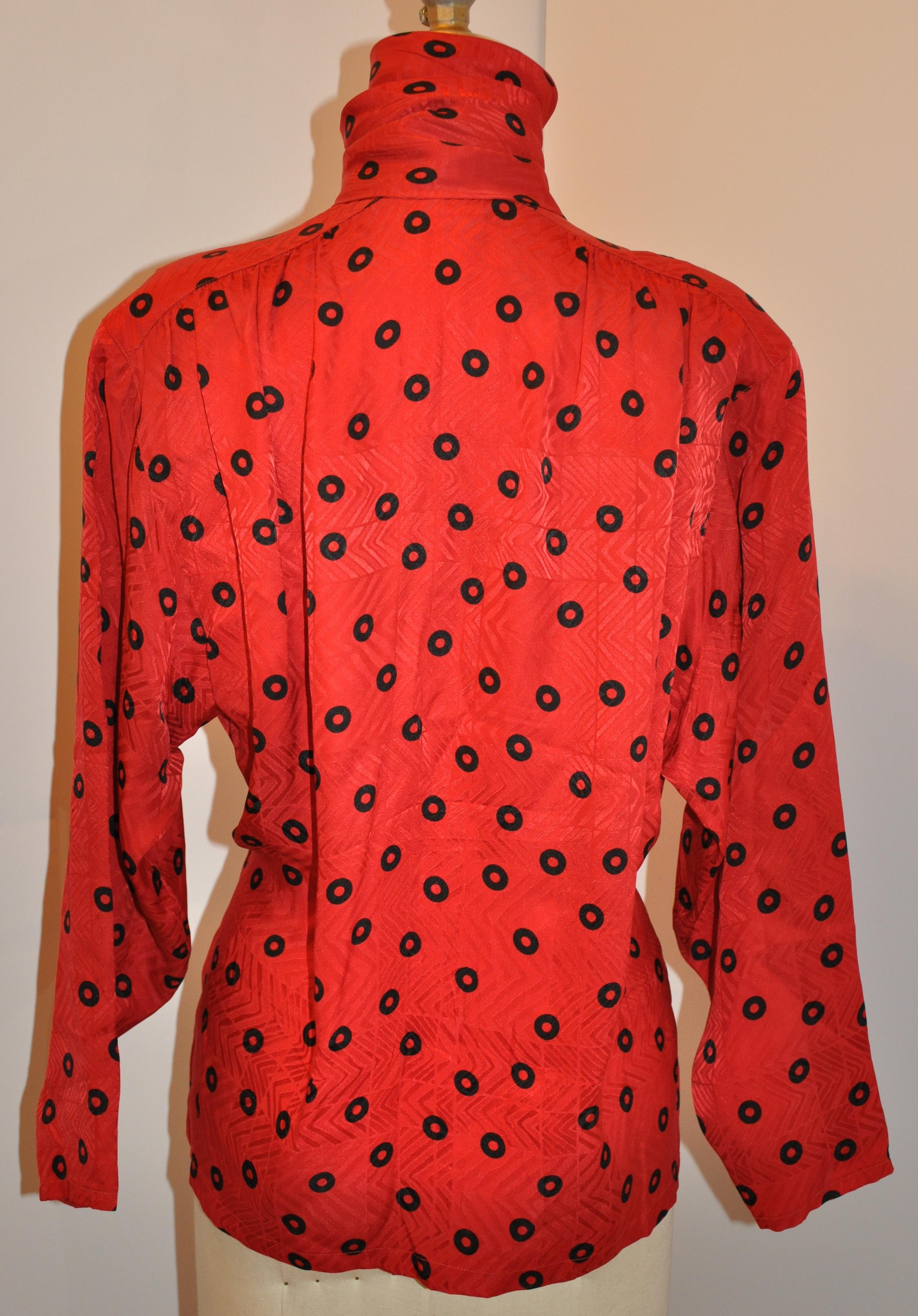       Christian Dior wonderfully elegant Red-on-red abstract print accented with black polka-dot silk crepe di chine blouse features an 5 1/2 inches by 52 inches extended collar offering many options in wearing. The interior has French seams and