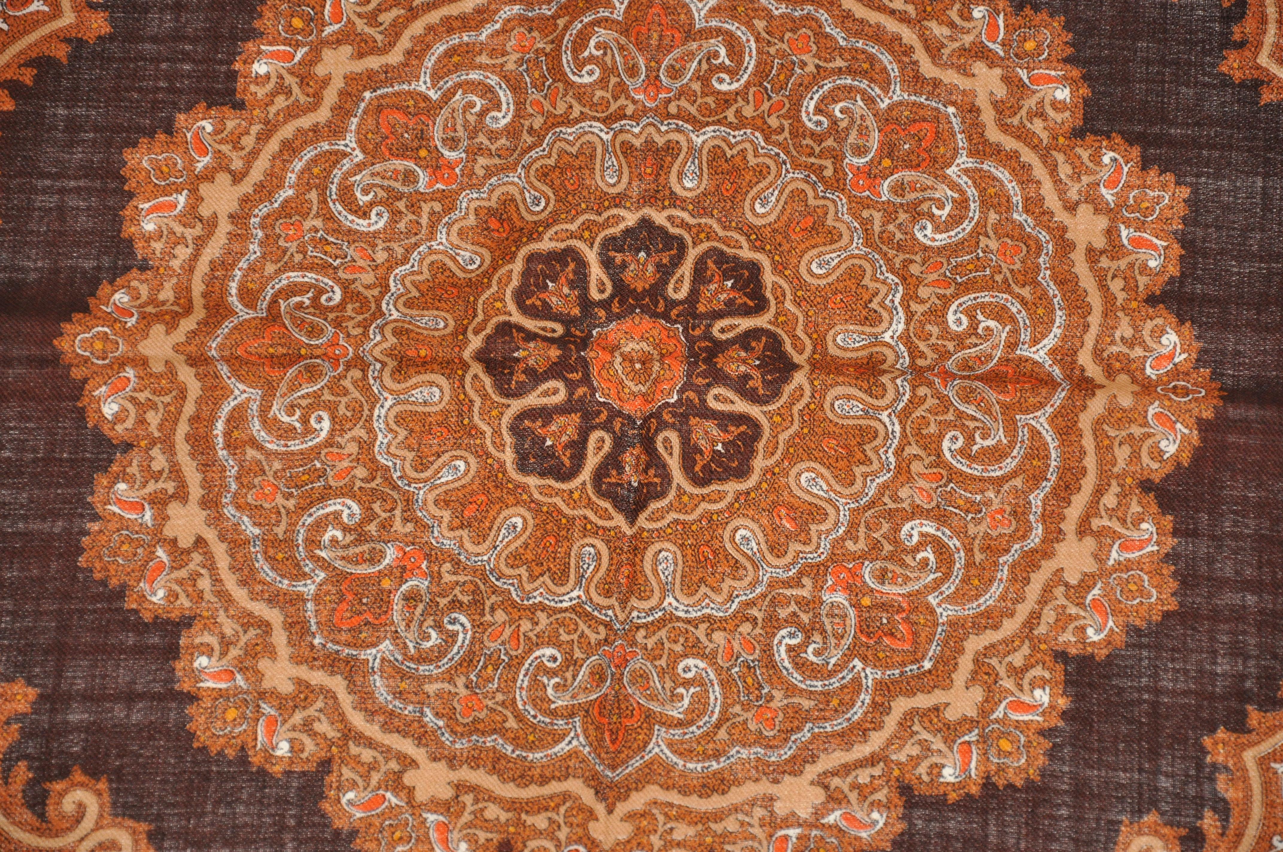        This wonderfully elegant wool challis scarf in rich shades of browns and cream with classic Palseys, measures 29 inches by 29 inches. Made in Italy.