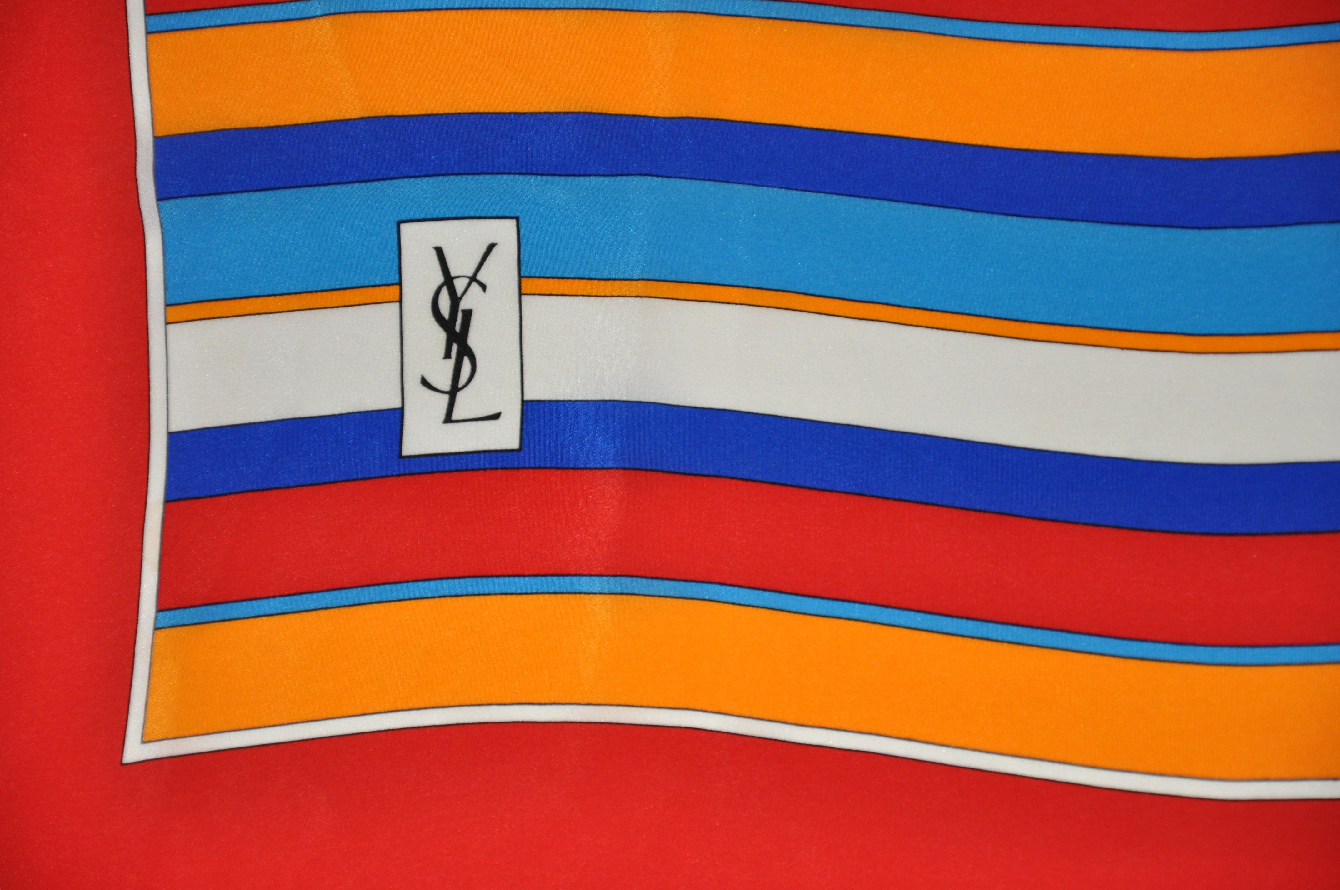        Yves Saint Laurent wonderfully vivid multi-color multi-sized striped silk scarf measures 34 inches by 34 1/2 inches, with hand-rolled edges. Made in France.