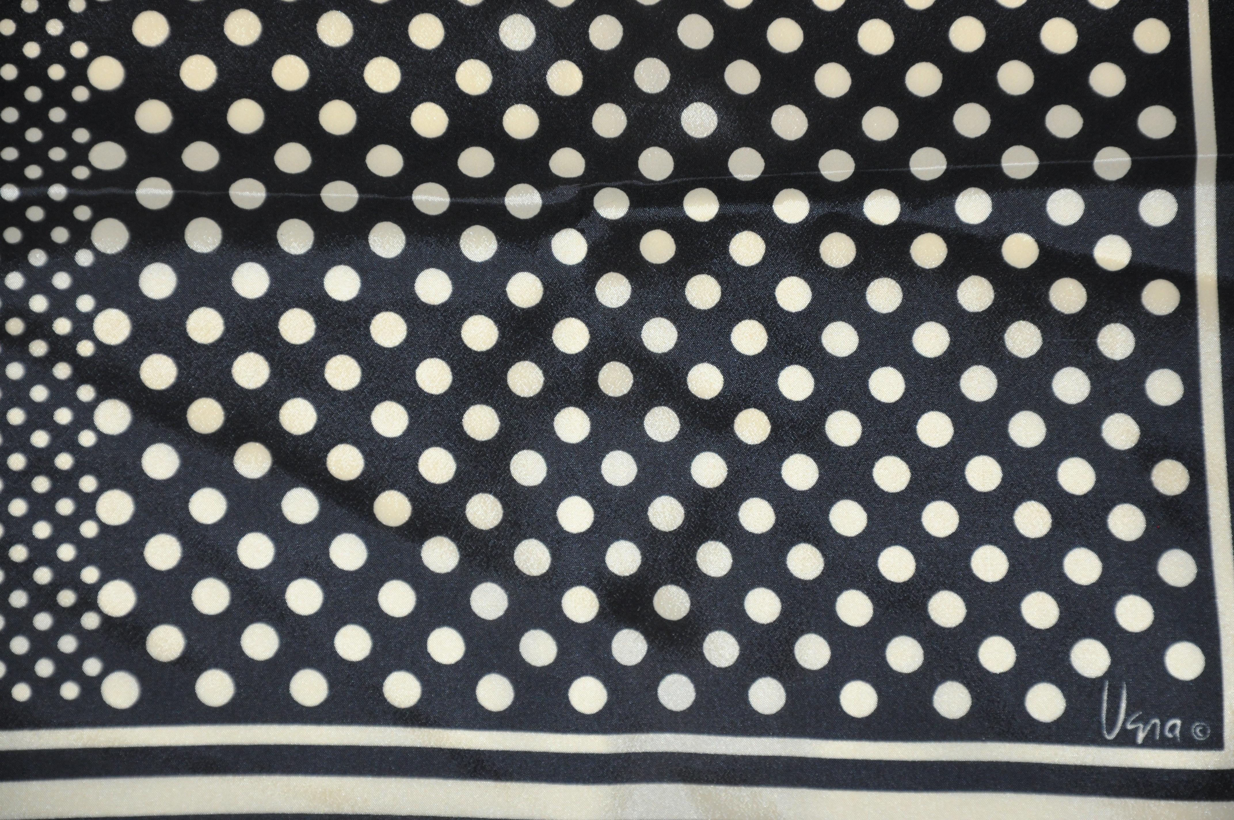        Vera multi-size Polka dots accented with multi-size stripe borders in black and taupe is finished with hand-rolled edges. Size measures 27 inches by 27 inches. Made in Japan of polyester.