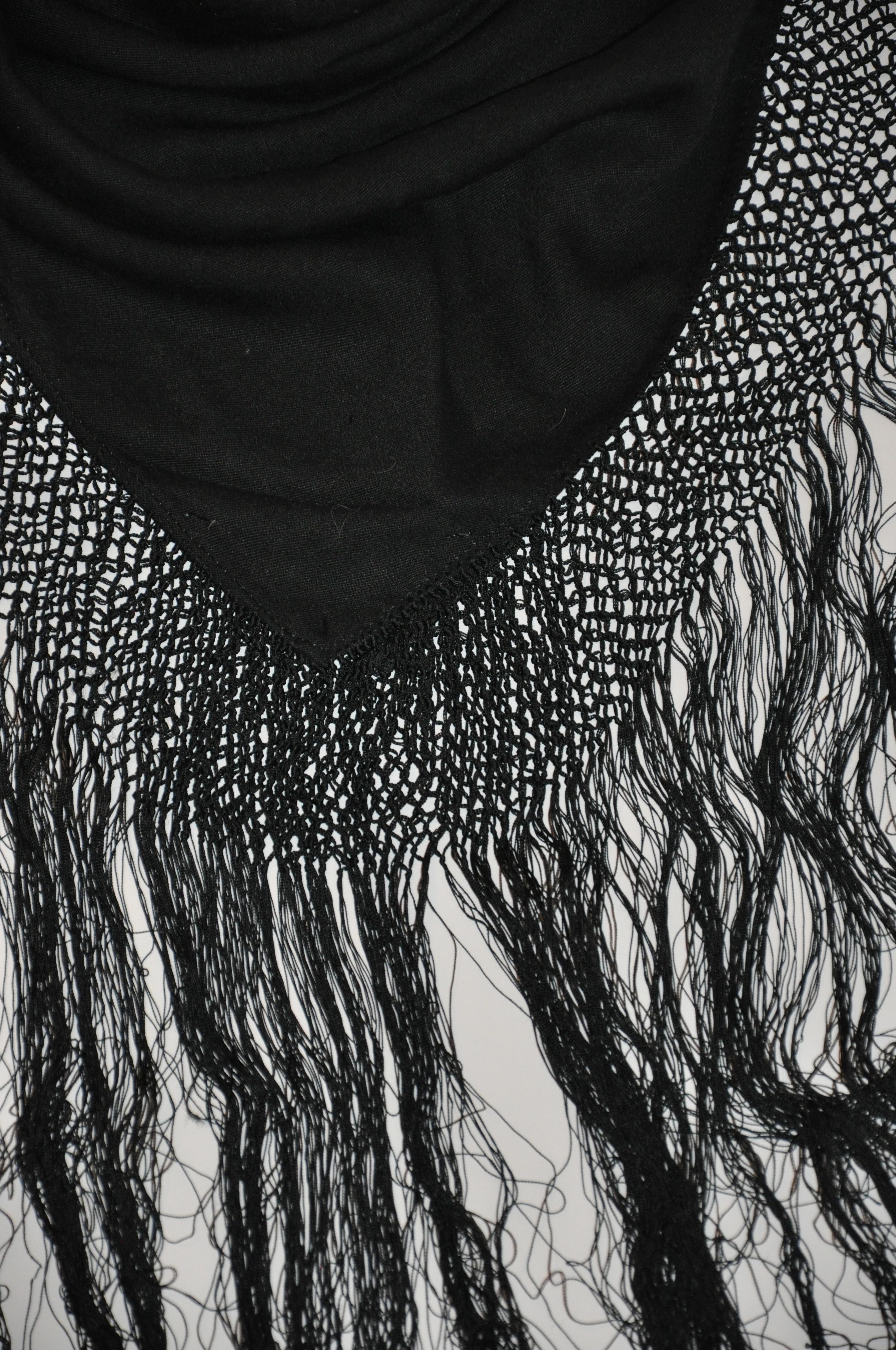       This wonderfully and dramatic huge black wool scarf and optional shawl is detailed with multi-tier hand-knotted silk cord surrounding all four sides along the border. The hand-knotted multi-tier measures 2 1/4 inches in length and finished