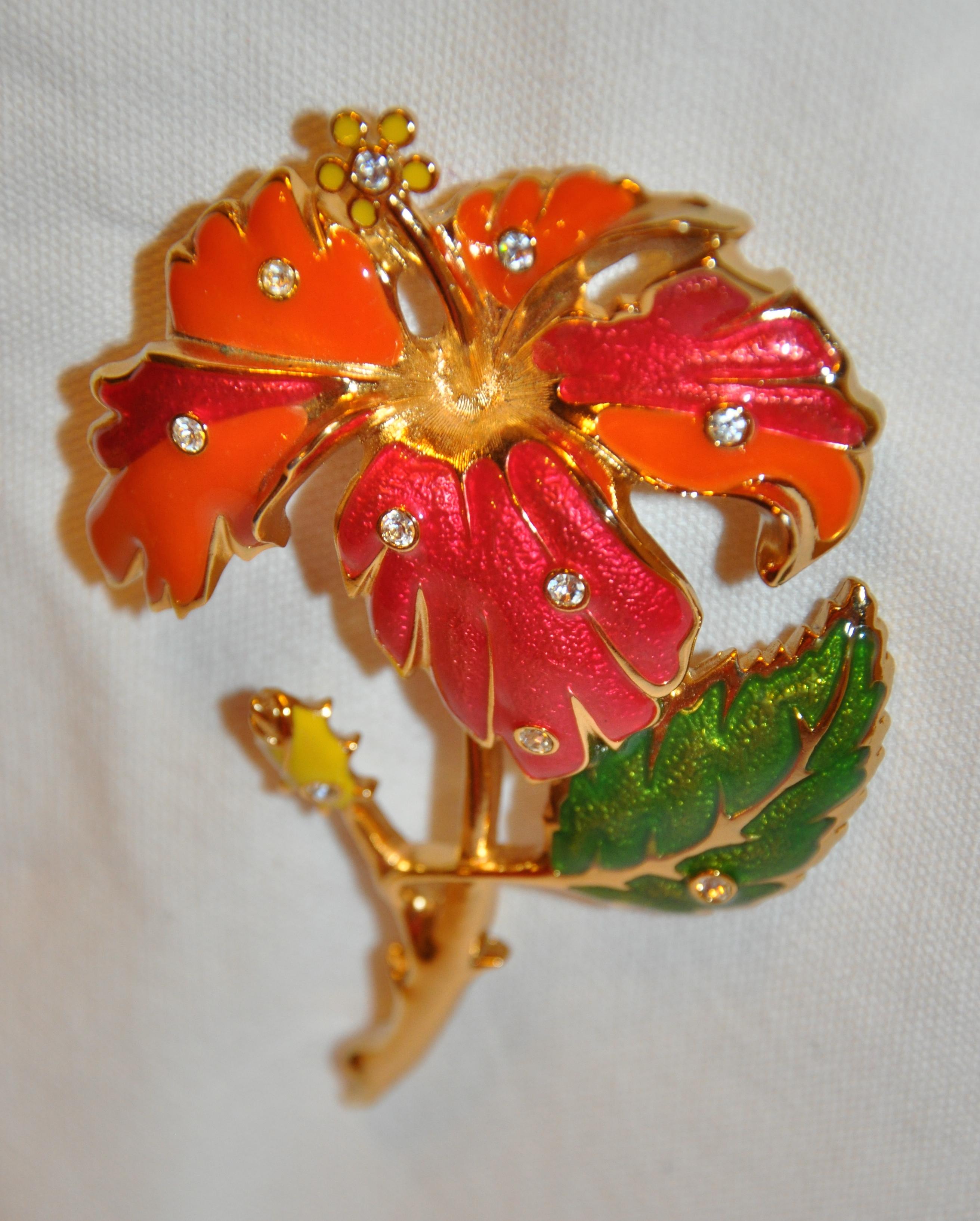        Barrego wonderfully huge multicolor whimsical floral gilded gold vermeil hardware scattered with faux diamonds throughout. Vivid colors of tangerine, cranberry, greens, and yellow, with etched floral-center. Etched with the designer's name in