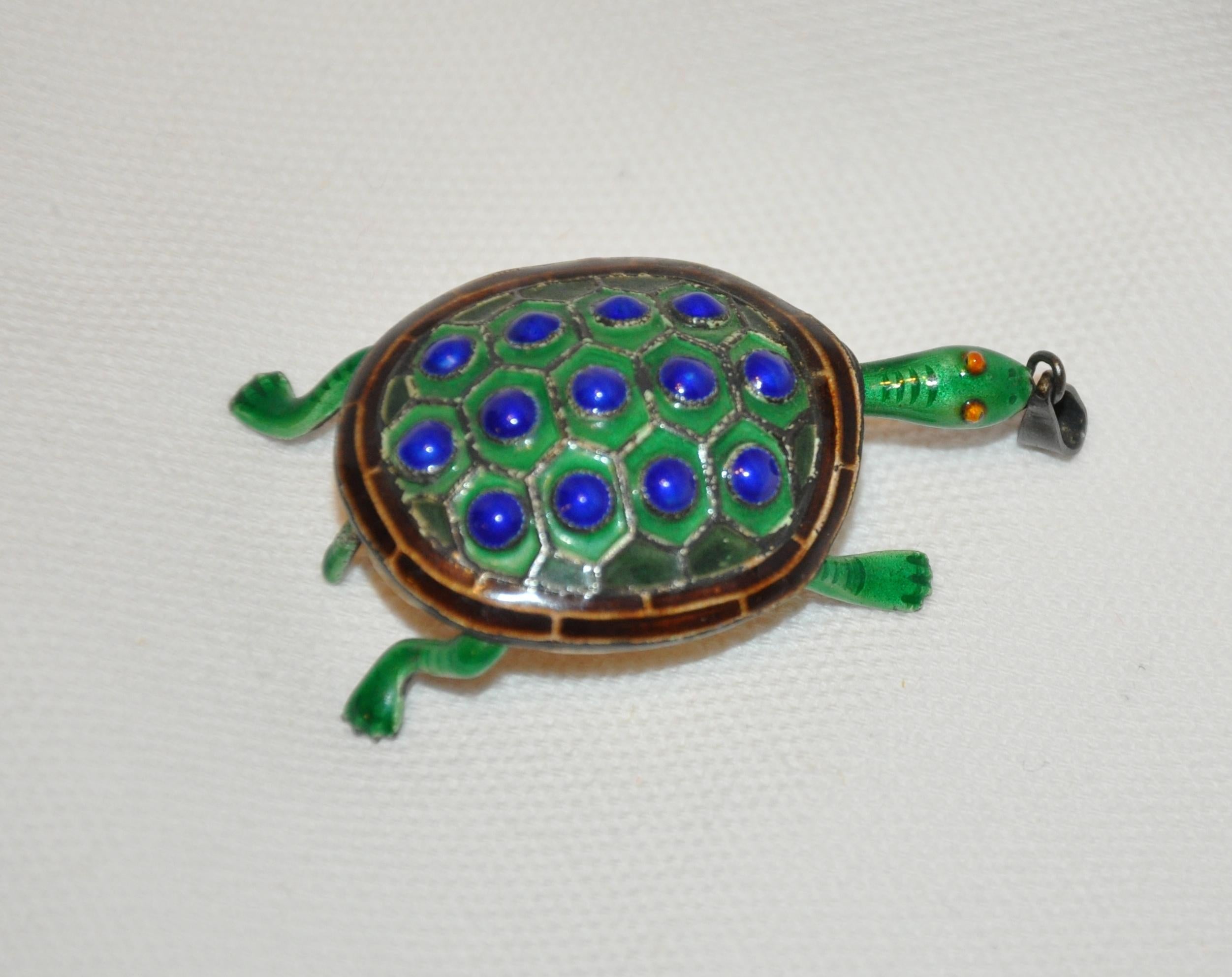      Whimsical silver-based inlay with lapis-blue & sea-green baked enamel 