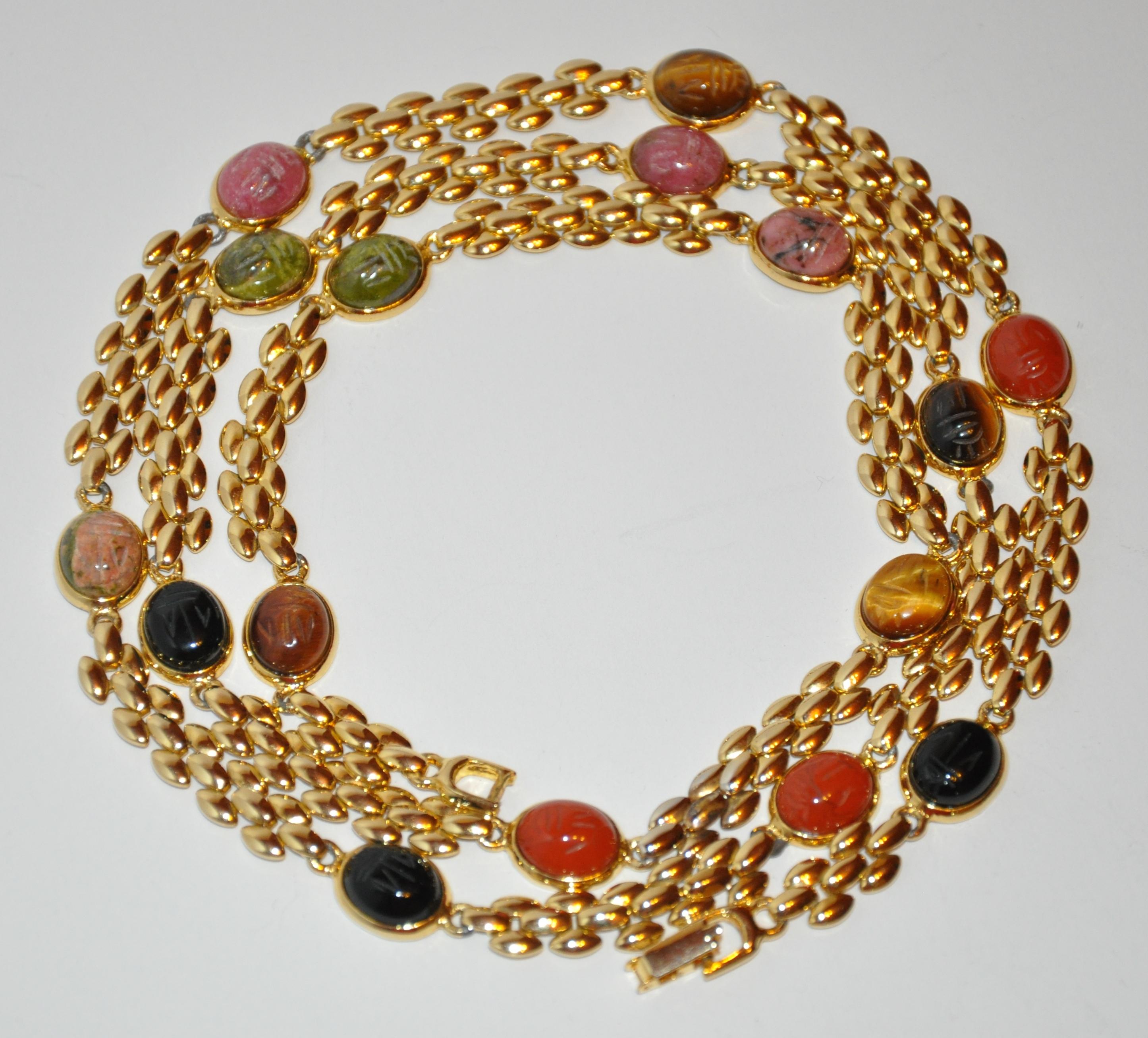        Wonderfully elegant gilded gold vermeil hardware chain necklace accented with multi-color etched scrab measures 35 inches in total length. Width measures 3/8 inch. Made in United States.