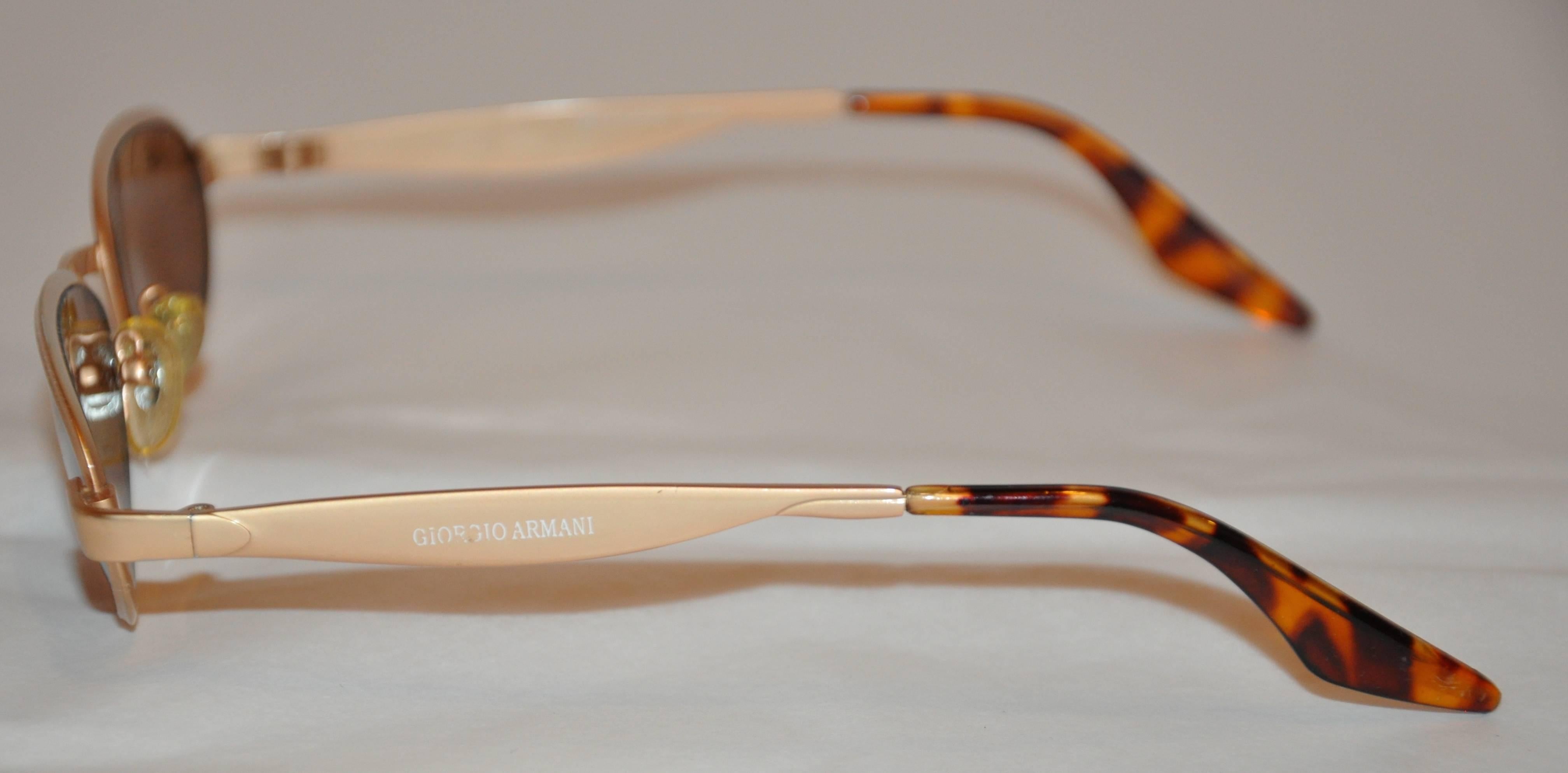           Georgio Armani polished gold hardware accented with tortoise shell  measures 5 1/2