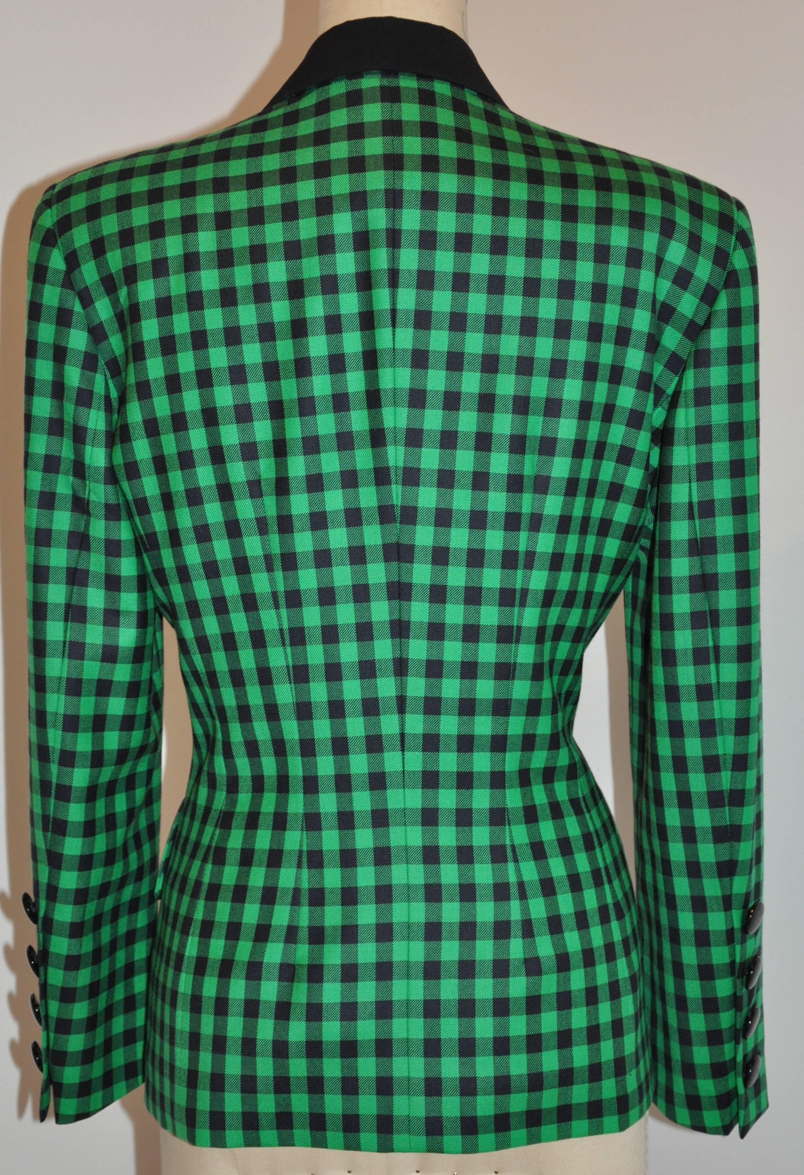           Escada bold green and black checkered blazer bu Margaretha Ley is detailed with two set-in pockets as well as flaps in front with four buttons on each cuff. The shoulders measures 17