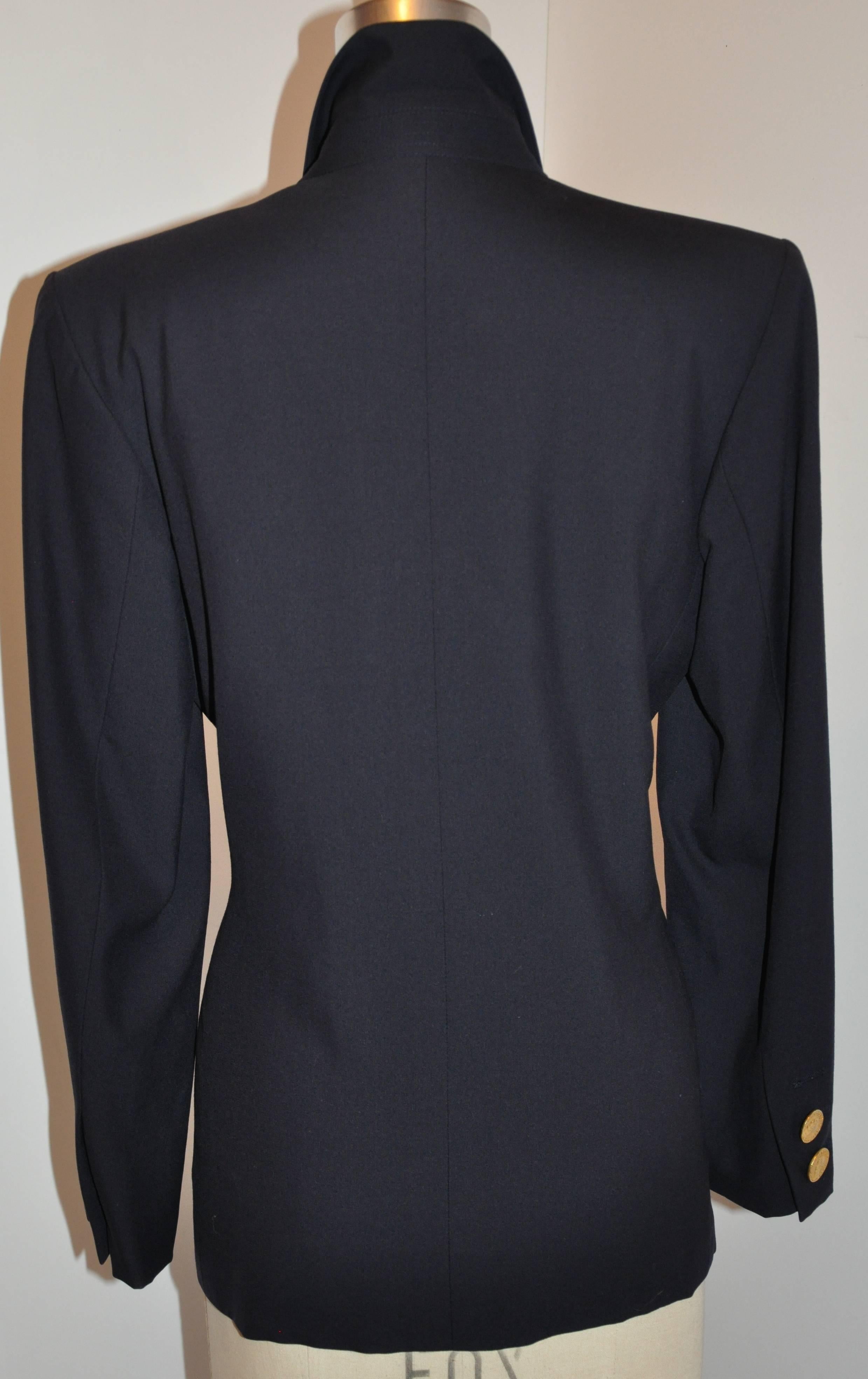           Yves Saint Laurent rive gauche signature navy double-breasted blazer is accented with detailed gold hardware 