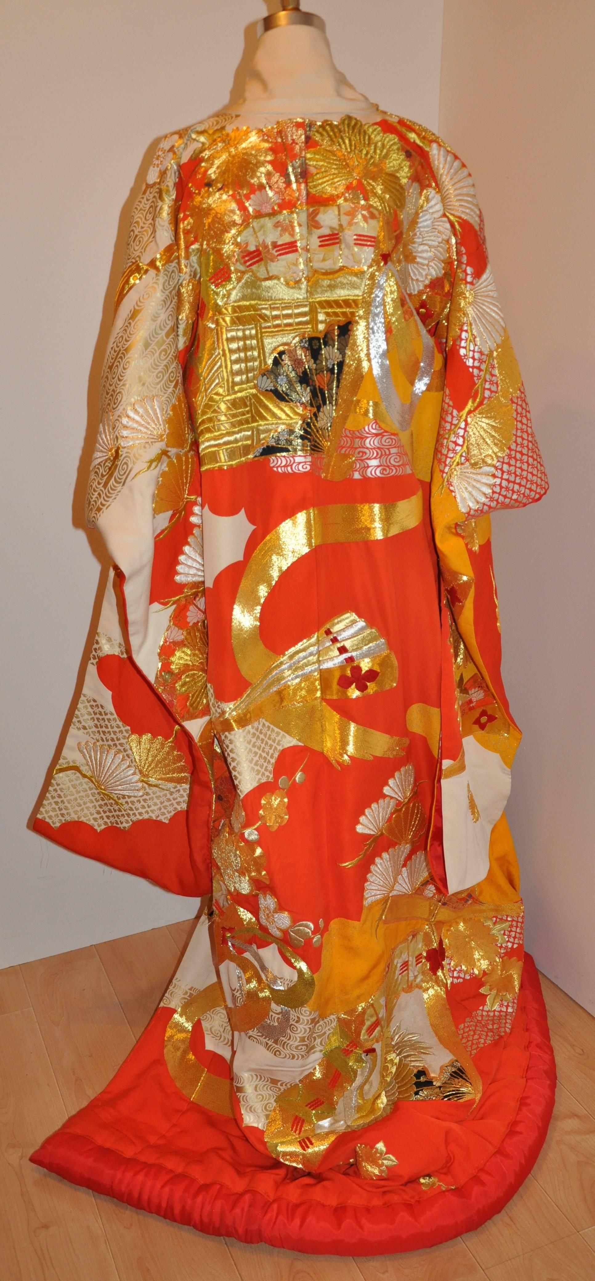           This simply wonderfully detailed ceremonial Japanese kimono of rich multi-colors, embroidered with gold and silver metallic threads, rich hand-embroidered brocades combined with silk textured ribbon of tangerines & creams. The wonderful