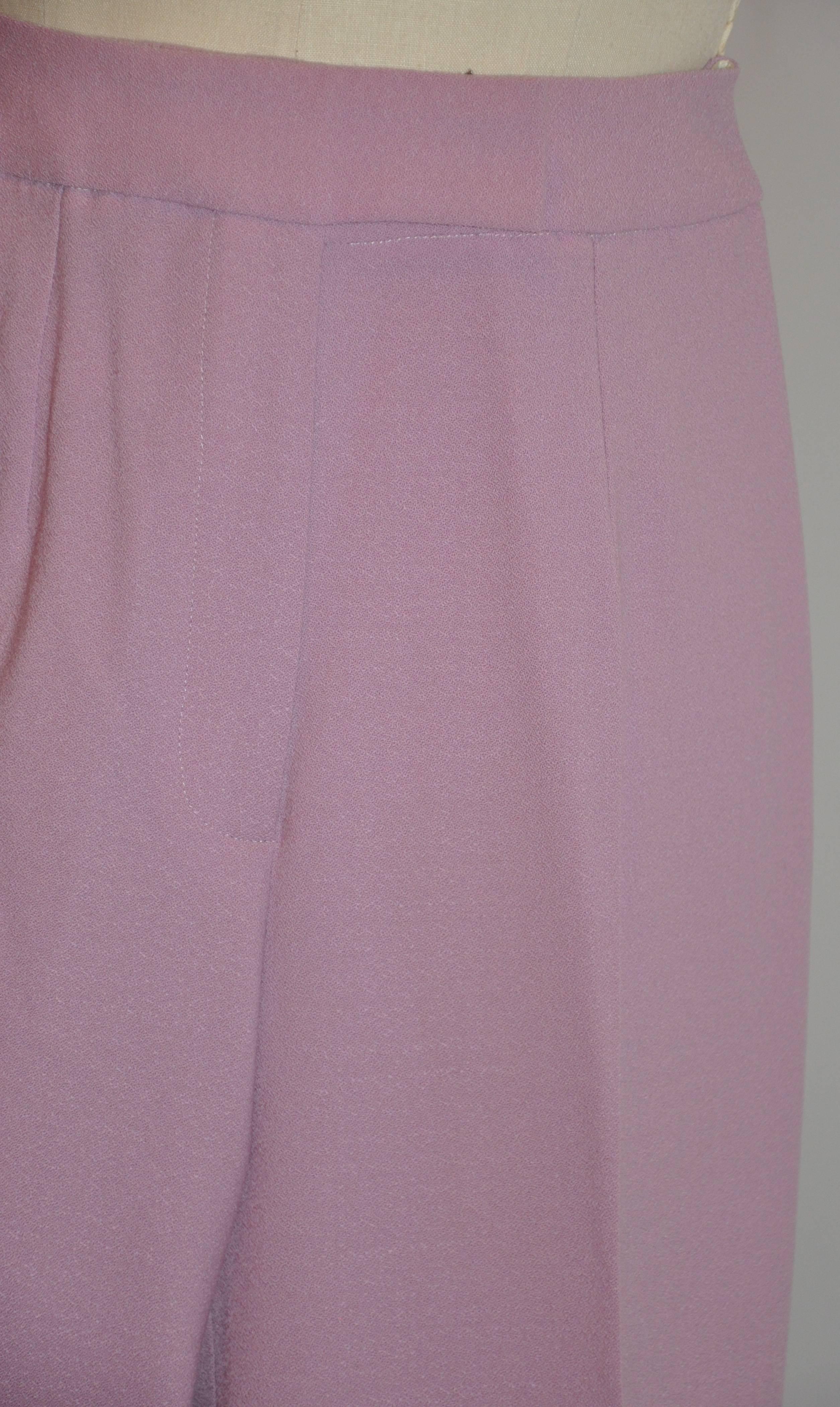         John Galliano's classic and elegant high-waisted medium-weight lavender wool crepe combined with 3% spandex for that perfect fit where needed measures 41 1/2