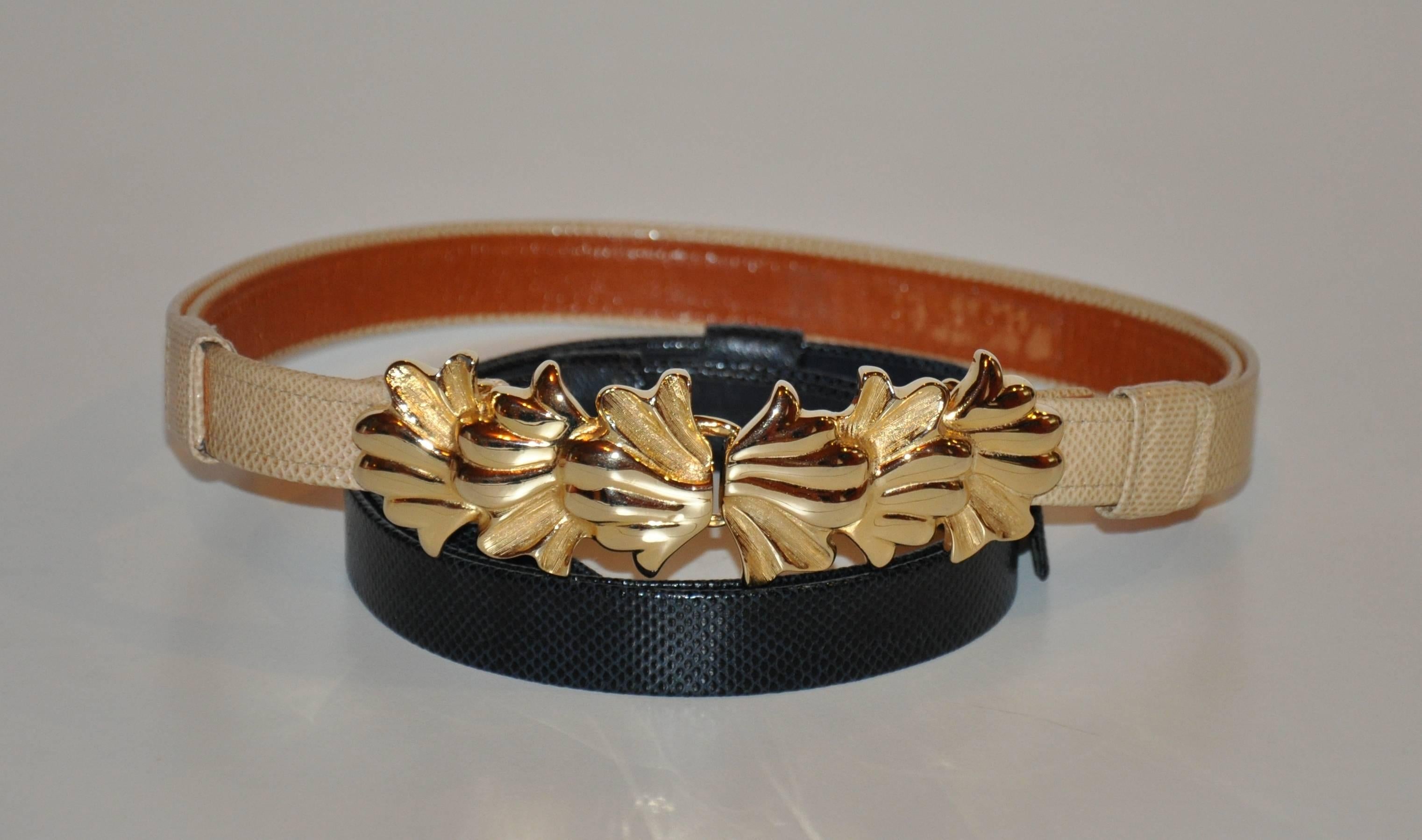             Alexis Kirk bold gilded gold hardware belt buckle with vermeil finish comes with a choice of two textured leather adjustable belts, one in beige lined with tan leather. And the other a textured black leather lined with black leather.