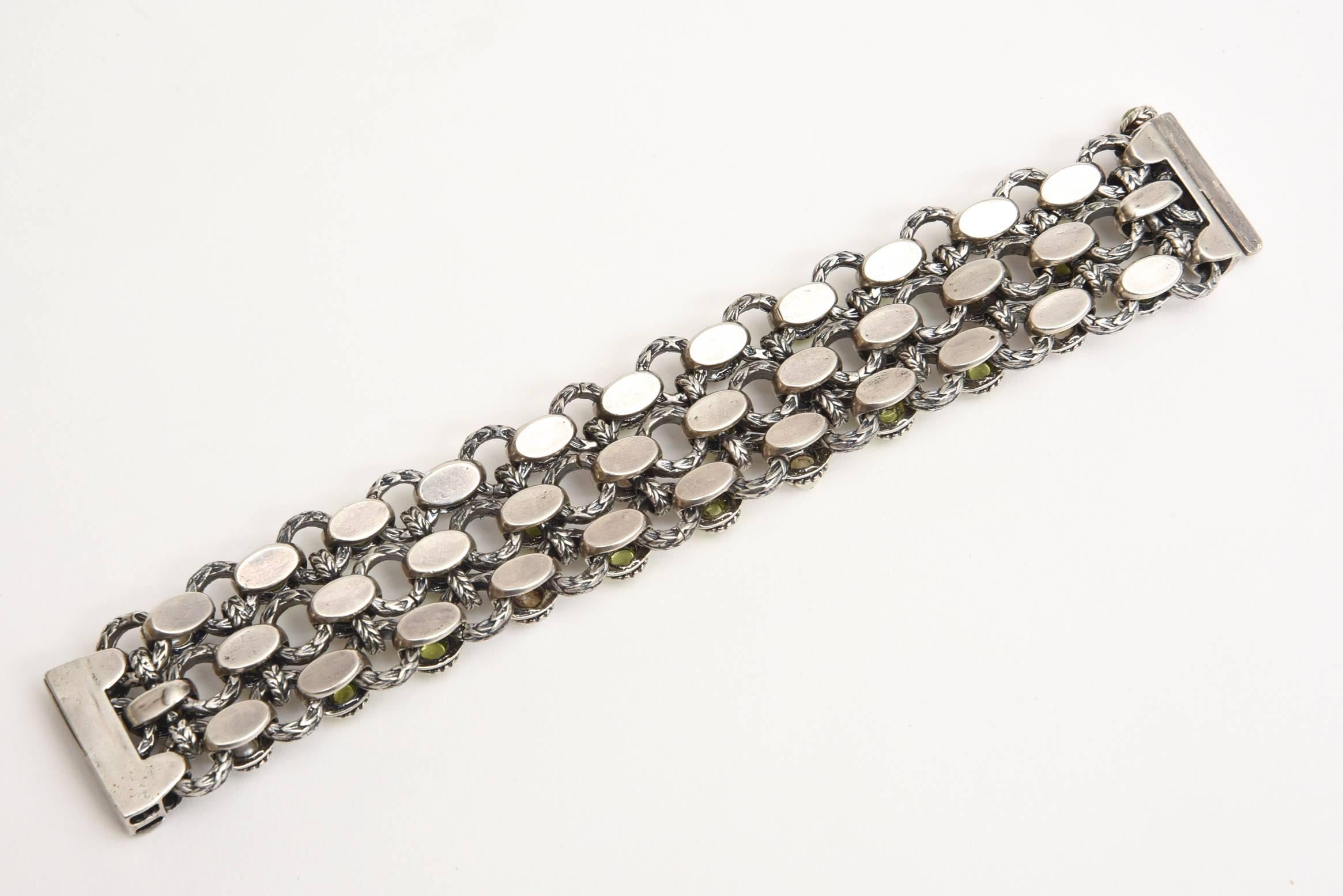 This beautiful bracelet is set against sterling silver with rows of alternating real pearls and real peridot. It has good weight to it. The workmanship of the silver and origin of the bracelet has the influence of India or the Pakistan or somewhere