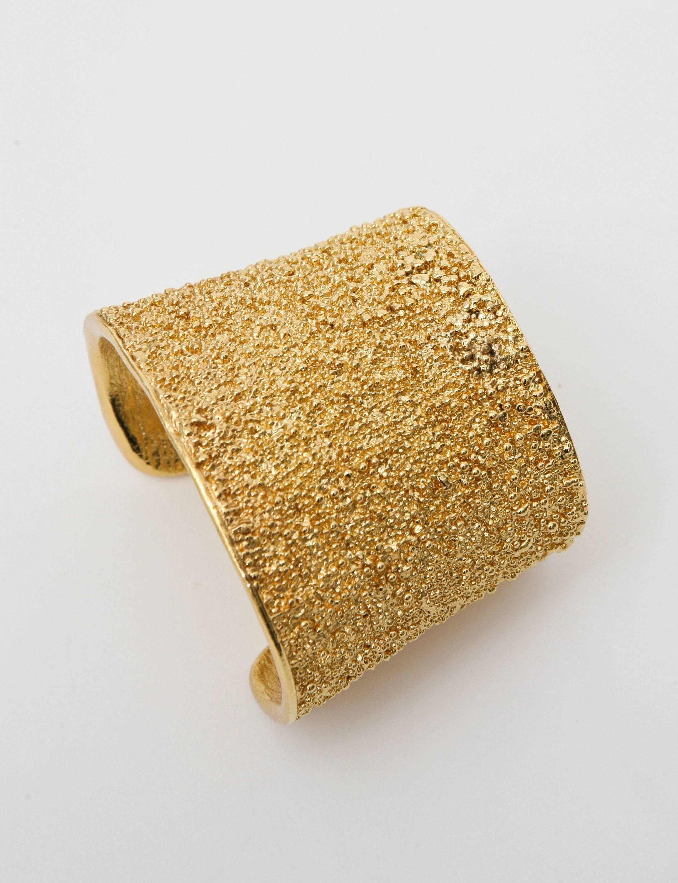 Women's Pair of Signed Yves Saint Laurent Textural Gold Plated Cuff Bracelets