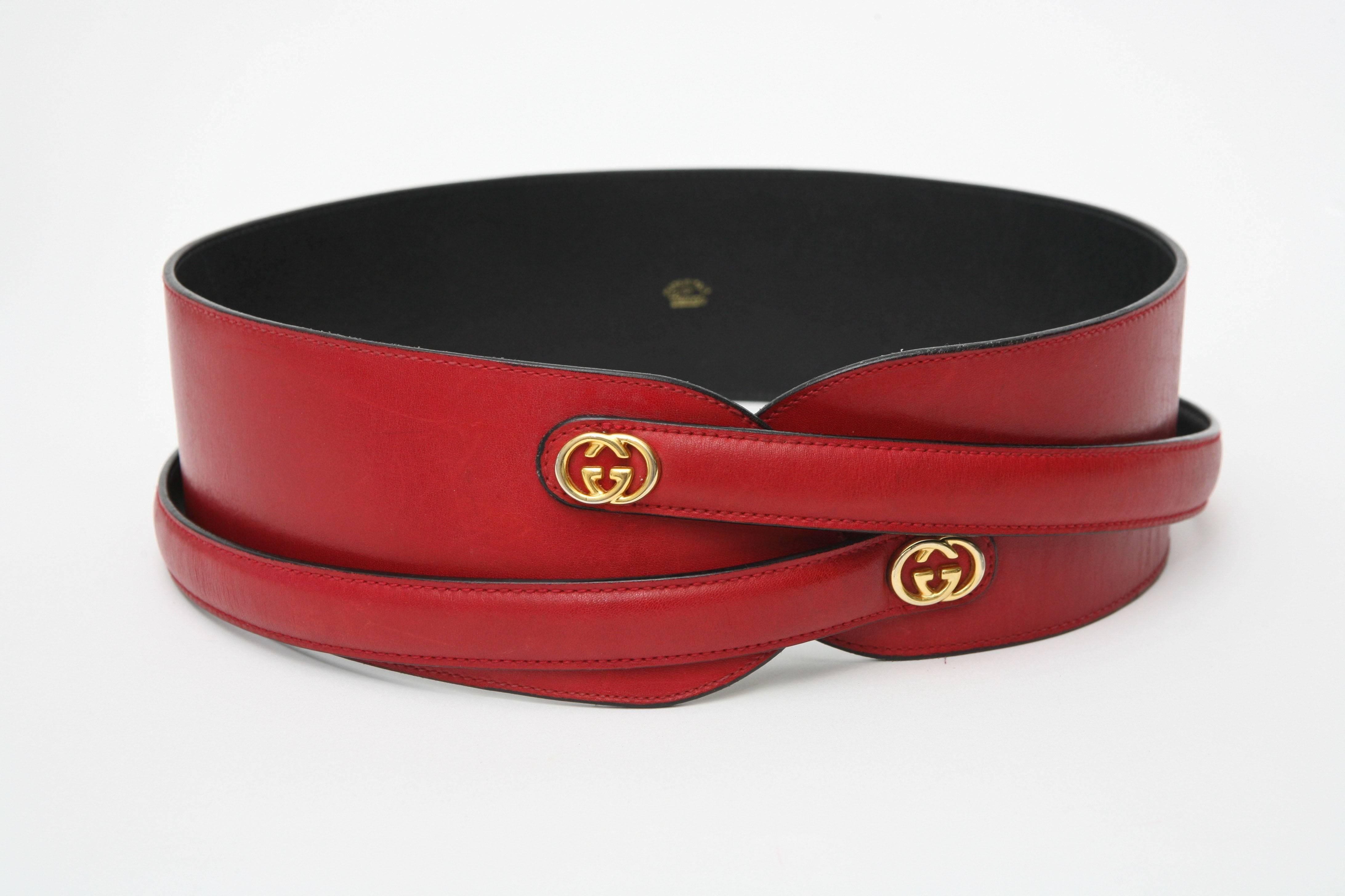 This lovely red leather Gucci belt has an overlapping cross cross strap that belts in the back. 
The color is a lovely red. Hallmarked on the inside Gucci Made In Italy.
It is for a very small waist.

NOTE: THIS WILL BE ON THE FIRST LAUNCH OF