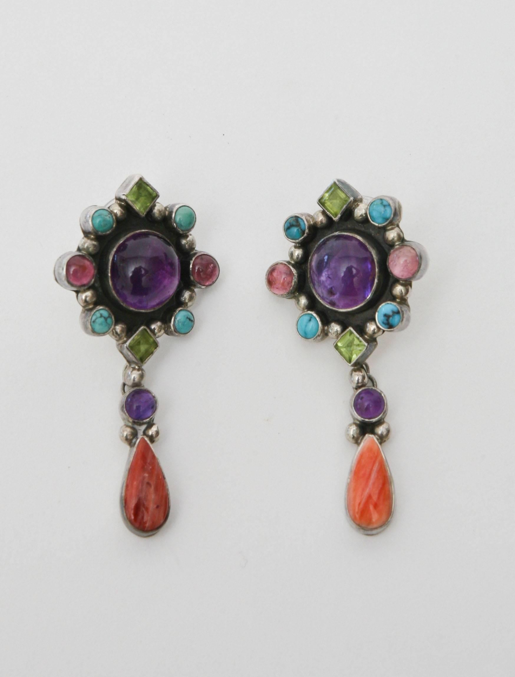 These lovely pair of earrings have all the beautiful stones of coral, turquoise, citrine, amethyst and tourmaline set against sterling silver.
They are beautiful on the ear and now perfect for all the summer colors and all seasons.
The only
