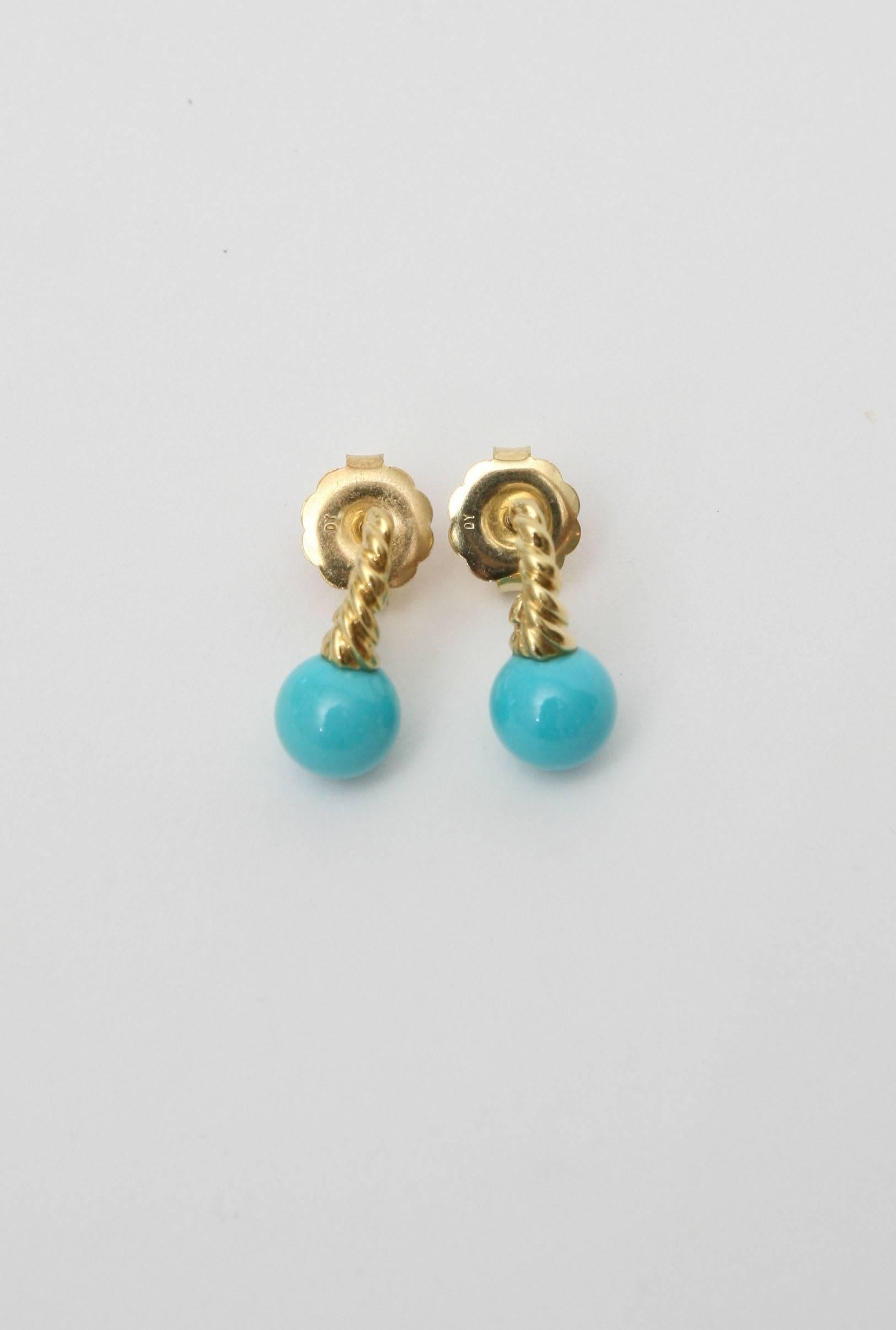 These small but beautiful pair of earrings have persian turquoise balls set against a rope and backing of 14 carat gold.
They are prefect for the young graduate and or a woman who likes small drop earrings on their ear lobe.

 