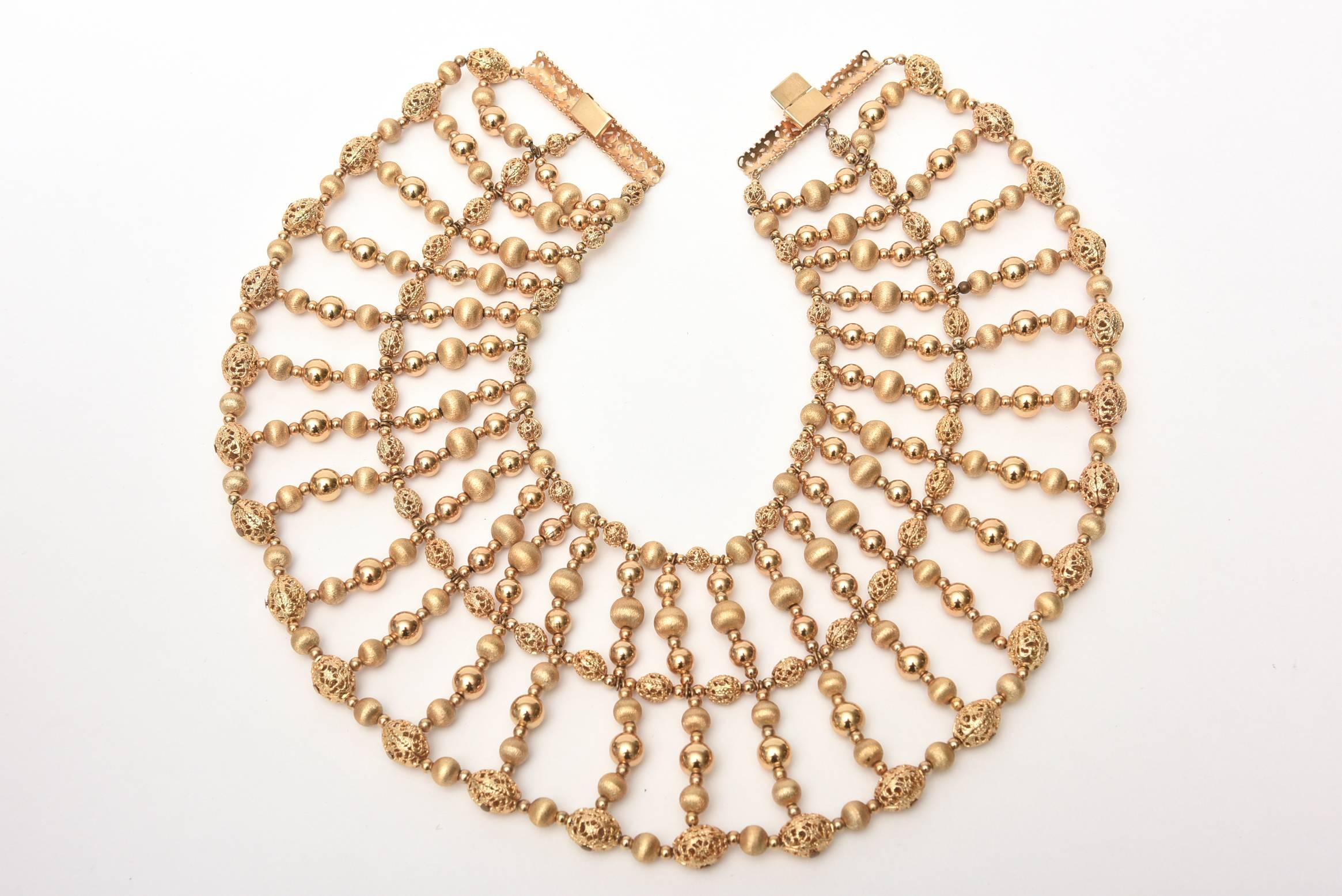 This monumental and arresting Cleopatra style show stopper beaded vintage Napier signed collar necklace is like wearing a piece of fashion and clothing in jewelry form.  It takes up a great space of chest/ collar and spans to the width of your