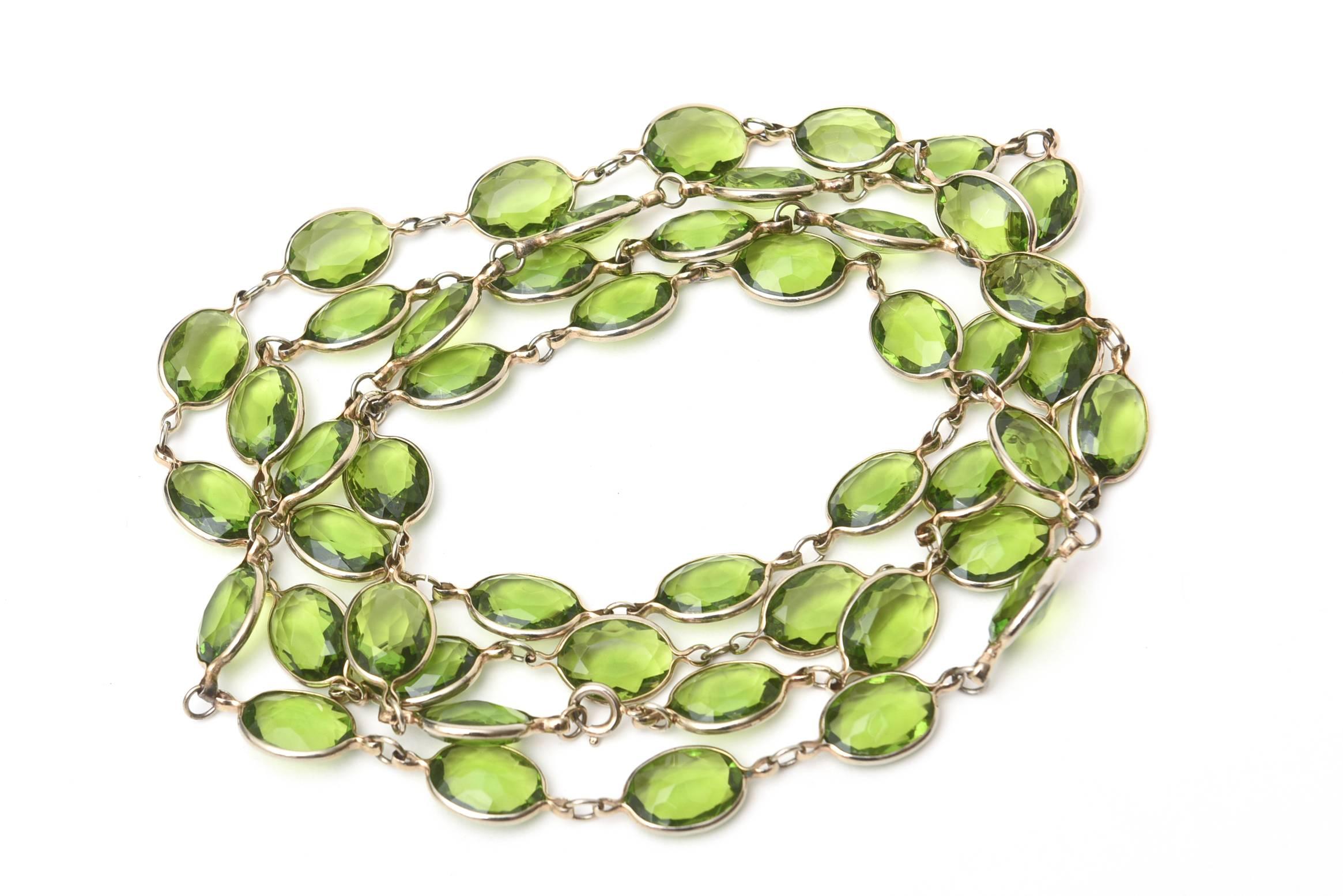 This long strand of chartreuse glass chain necklace can be doubled or tripled on a neck. it is 29