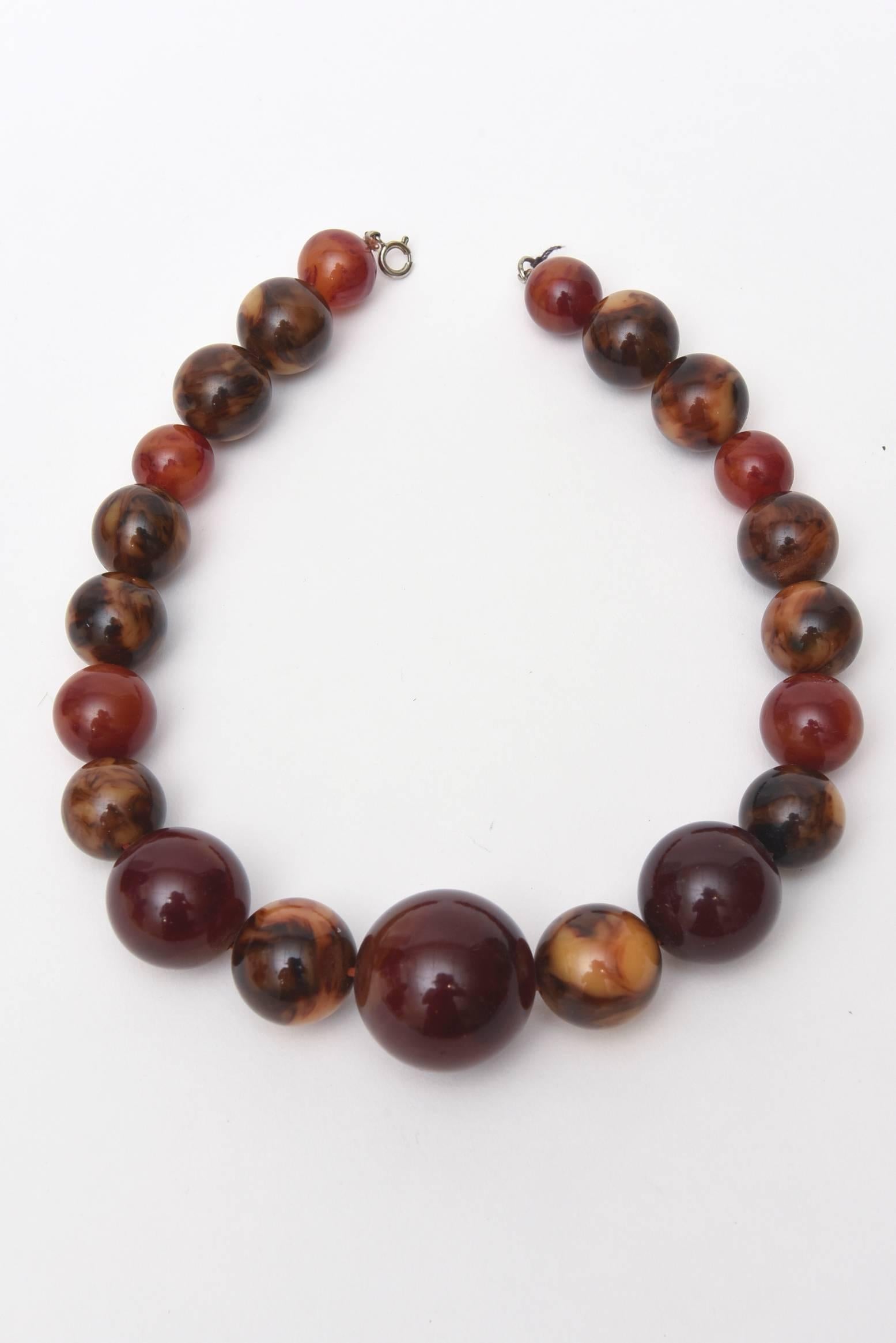This lovely necklace of graduated Beads of end of the day Bakelite in rich hues of reds, brown and amber are interspersed .
 This collar necklace is a perfect accessory for any fall wardrobe. These are some of the rich colors of fall 2016.
This