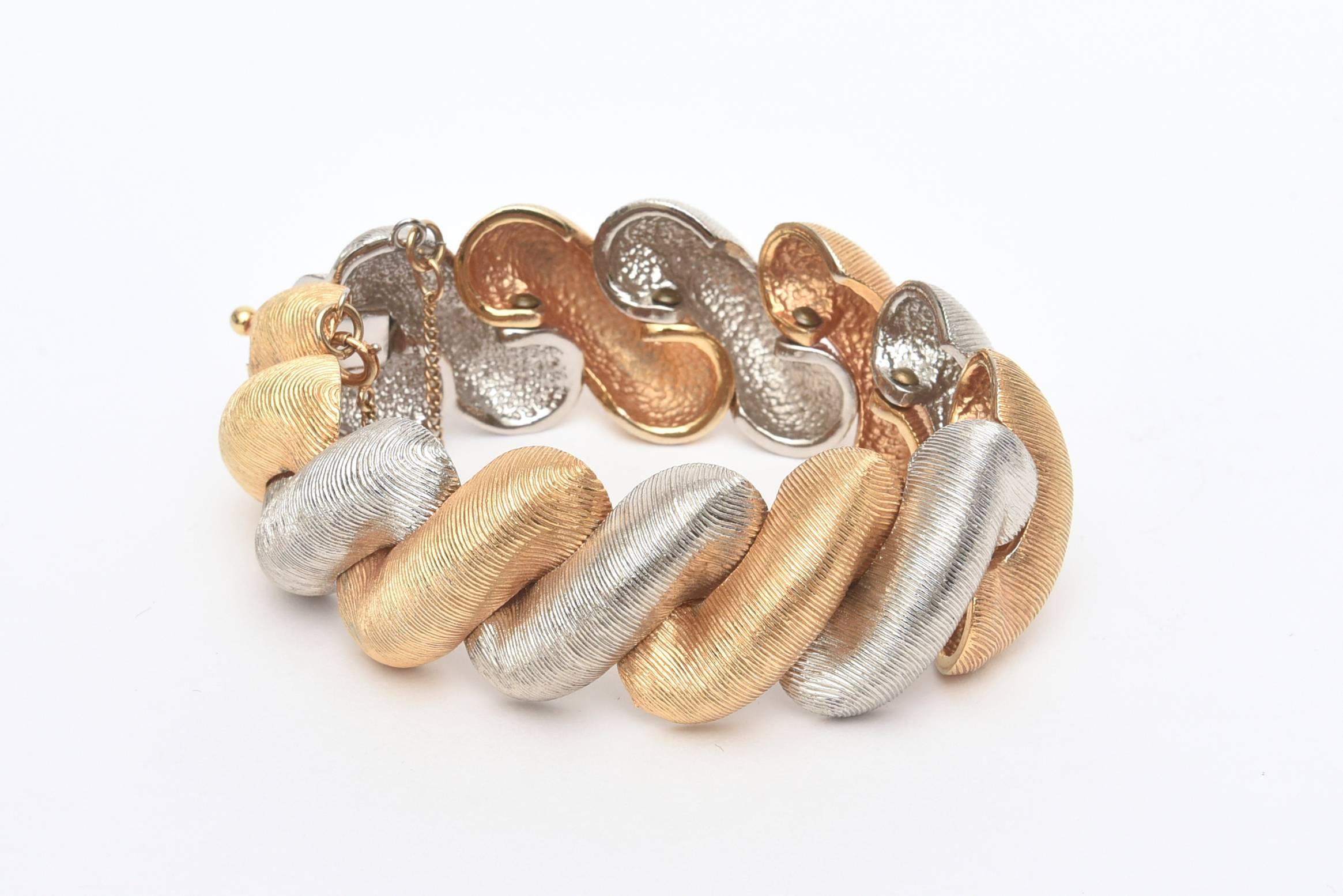 This stunning period bracelet looks authentic and real by Castlecliff. It is finely lined with a brushed satin finish on the metals. Has a modern elegance to it. Gold plated and silver metal, but looks like real gold and sterling silver. This is