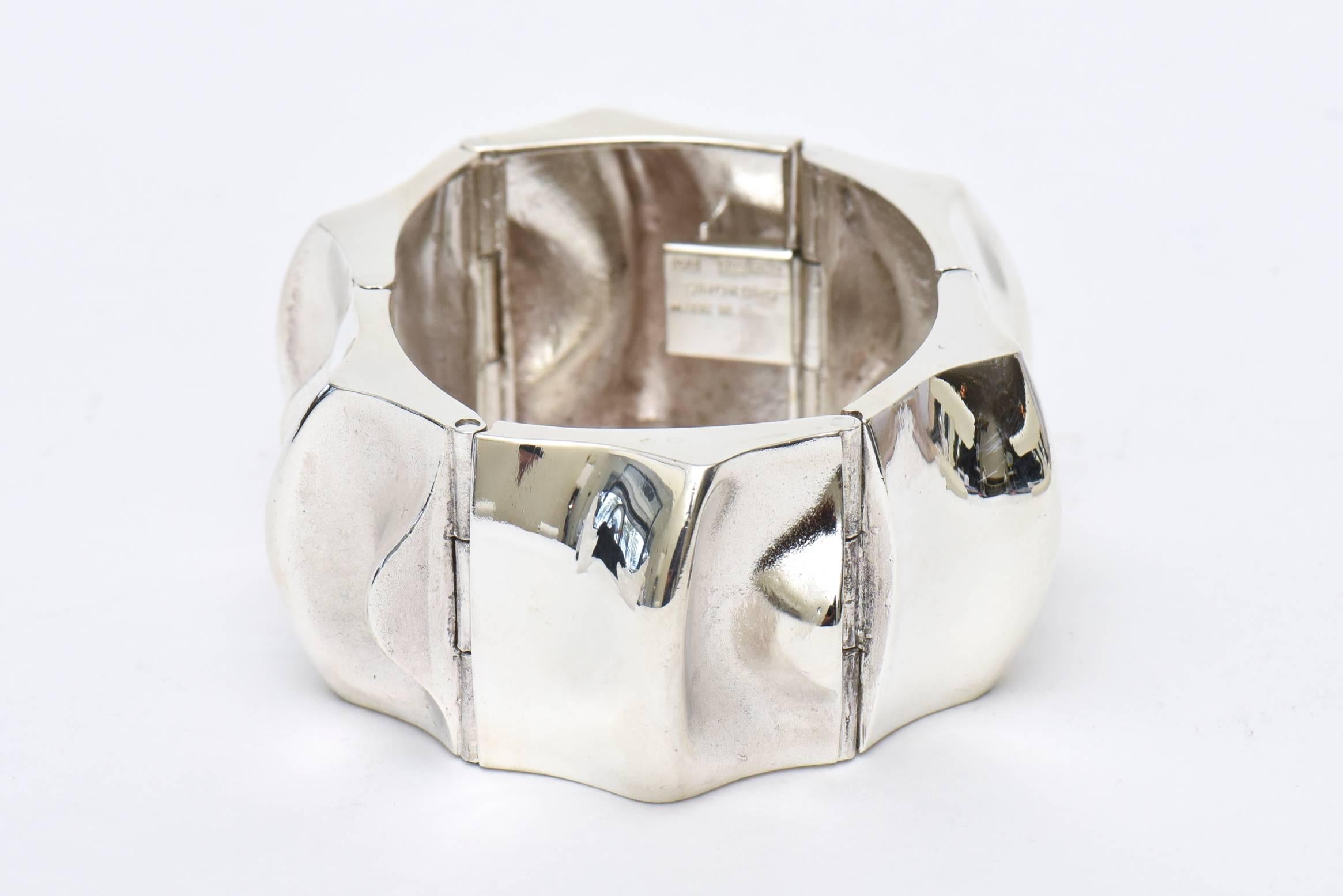 This hallmarked Scandinavian modern sculptural thick sterling silver signed cuff bracelet has the markings of Sorokoro MJH 925 Made in Fin. It is fabulous! Very modern and chic! It has presence and weight. Tres chic! It is from the 60's. Made in