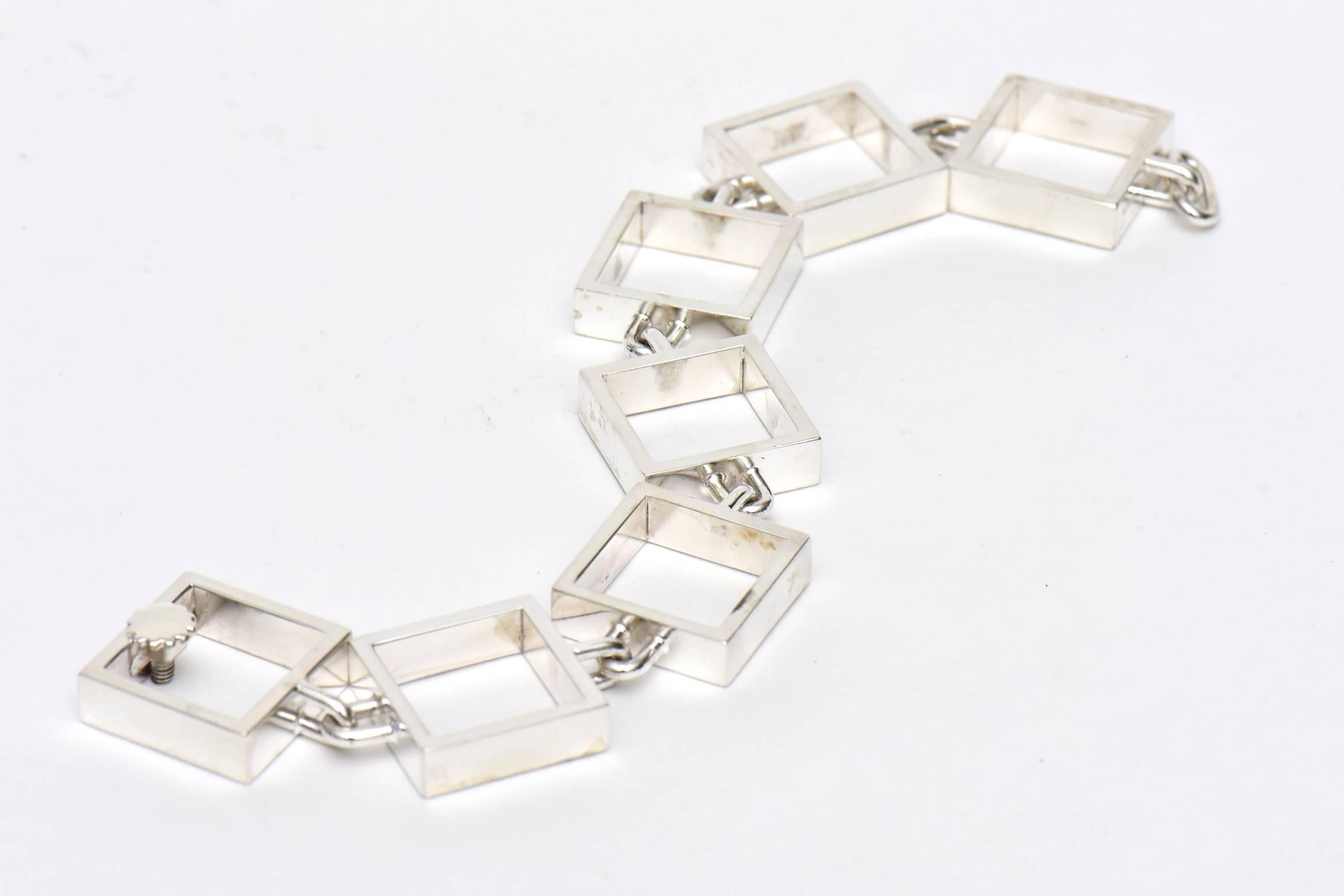 This hallmarked and signed Danish Hans Hansen sterling silver square link bracelet is highly sought after.
It unscrews for closure. It is marked 925S Denmark and the signature is in cursive. There is a number 7 also added. It is from the 60's. All