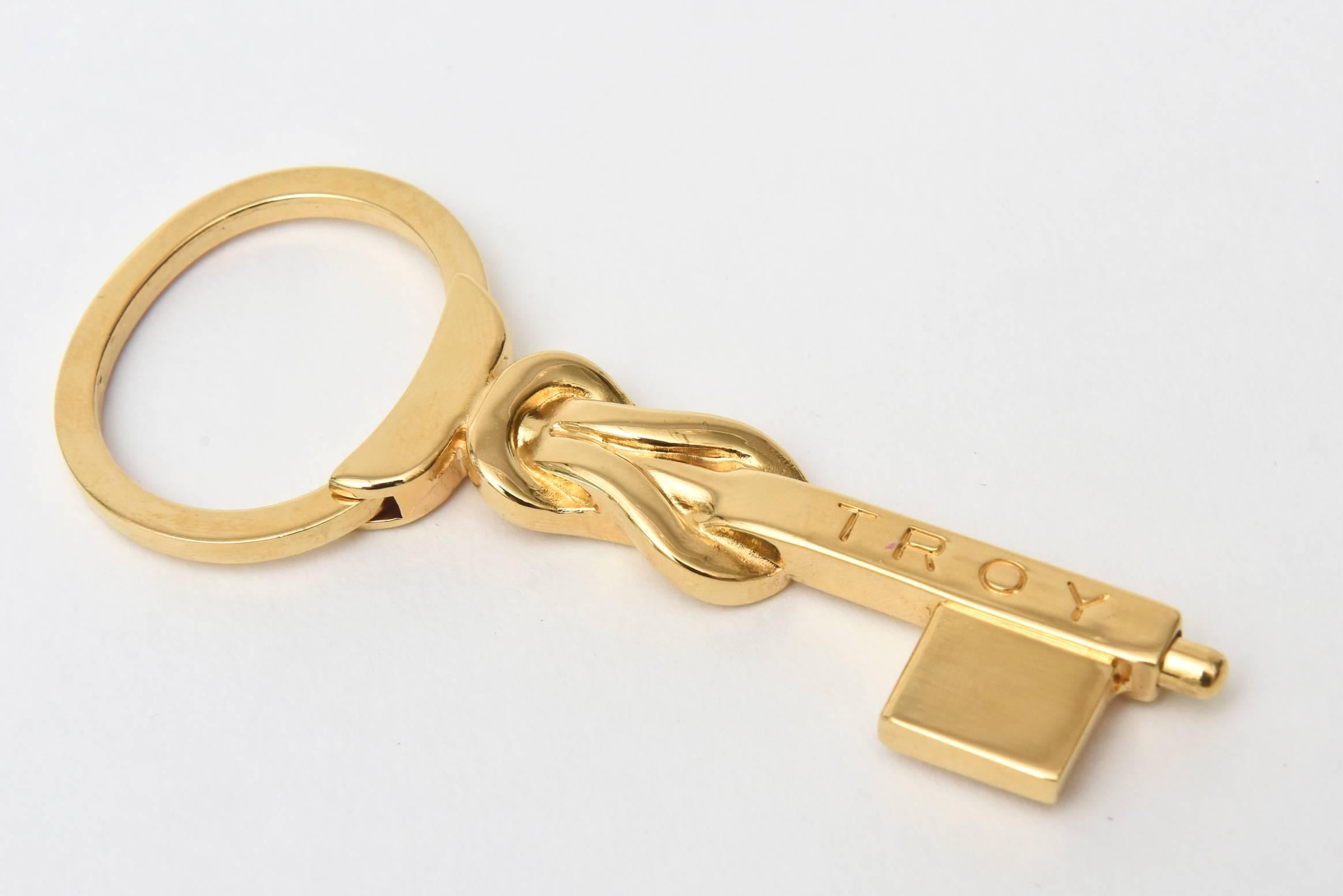 This Signed Gucci 1984 Italy key chain is all gold plated in the shape of a key.
It is signed Troy