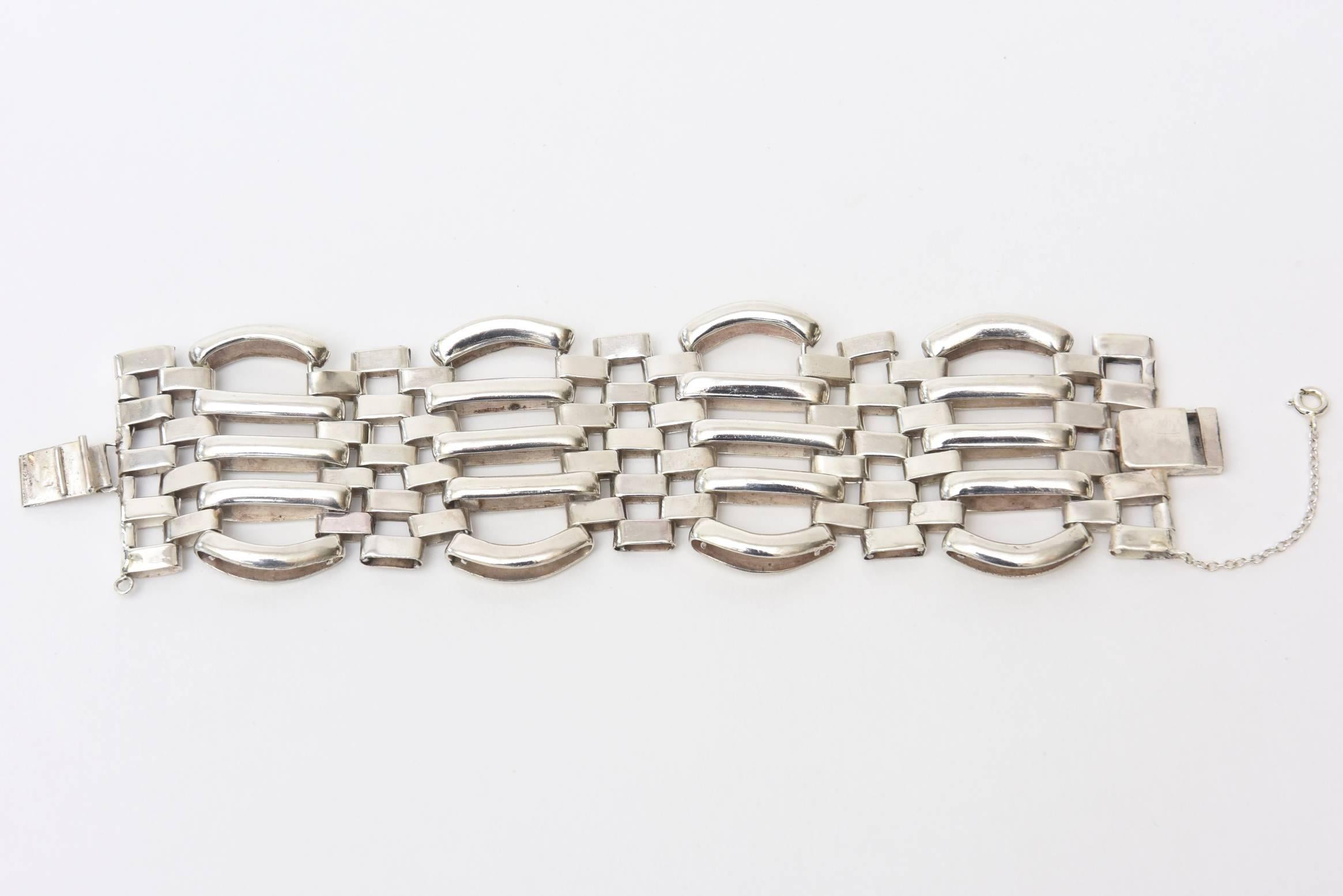 This wonderful vintage sterling silver cuff bracelet has great weight to it. It is modernist, minimalist and sculptural all at the same time. It fits beautifully on the wrist. The linear links of different sizes and forms add to the modernist look.