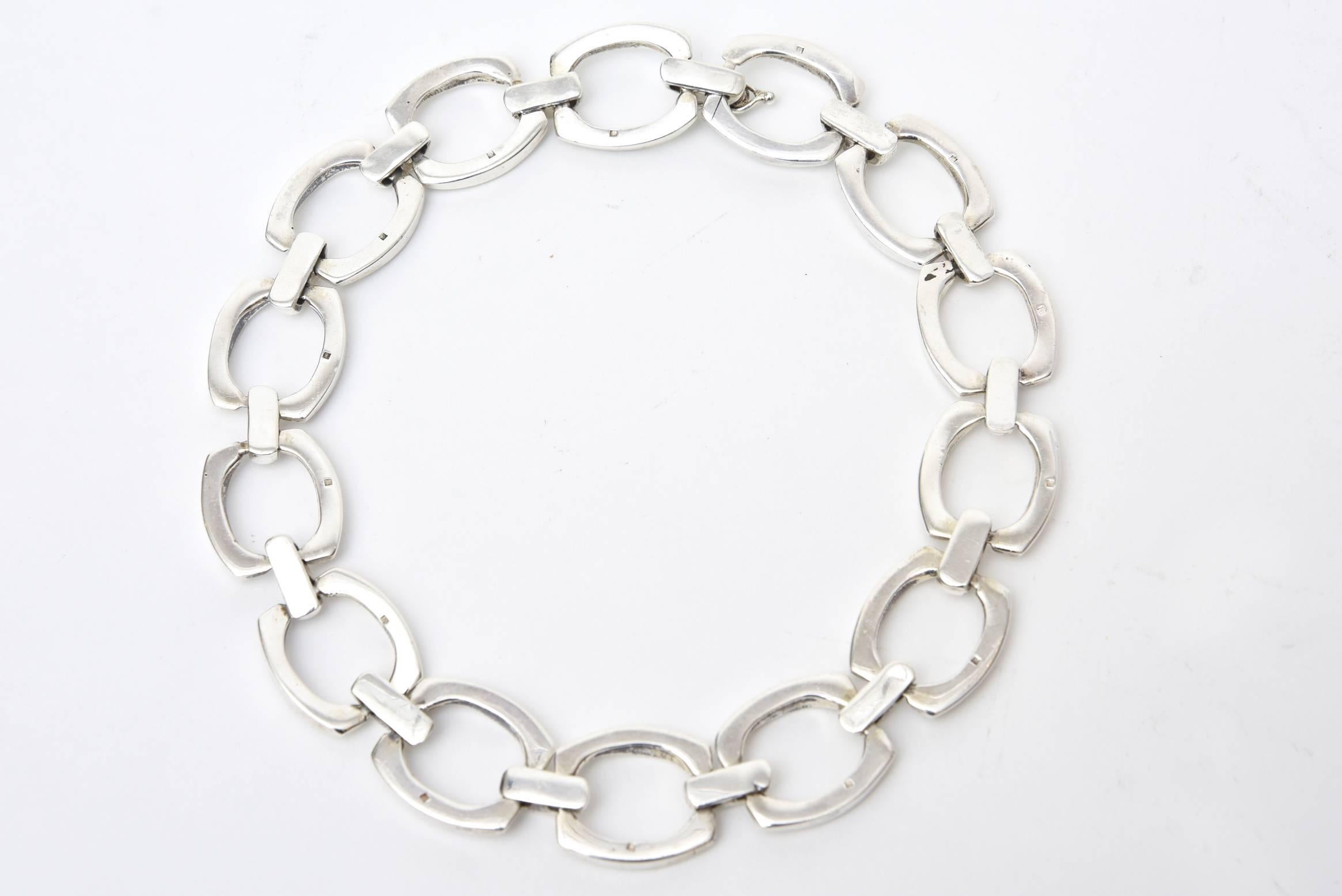 This stunning on heavy and chinky sterling silver link necklace has a markings on each link. It is either french or English. We do not know what the markings  and are at this research point. It is vintage from the 60's. Each link has a marking. The