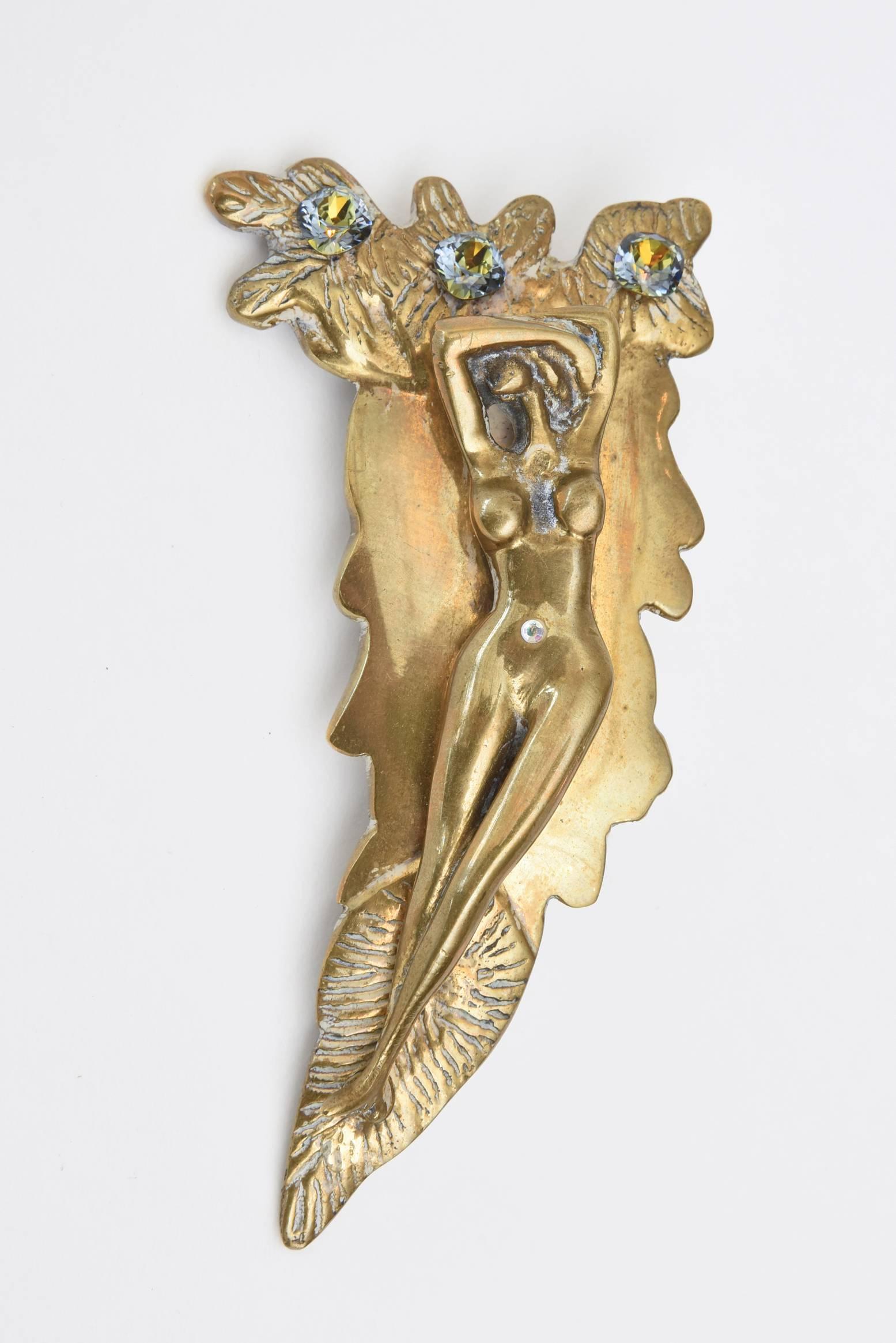 This studio one of a kind large and bold bronze sculptural designed belt buckle by Perella is most likely Italian. It has has boris aurelius glass stones with a reclining nude figure. It is most unusual and sensual. This is art and sculpture in one.