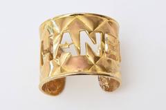 Chanel Gold Plated Quilted Logo Cutout Cuff Bracelet