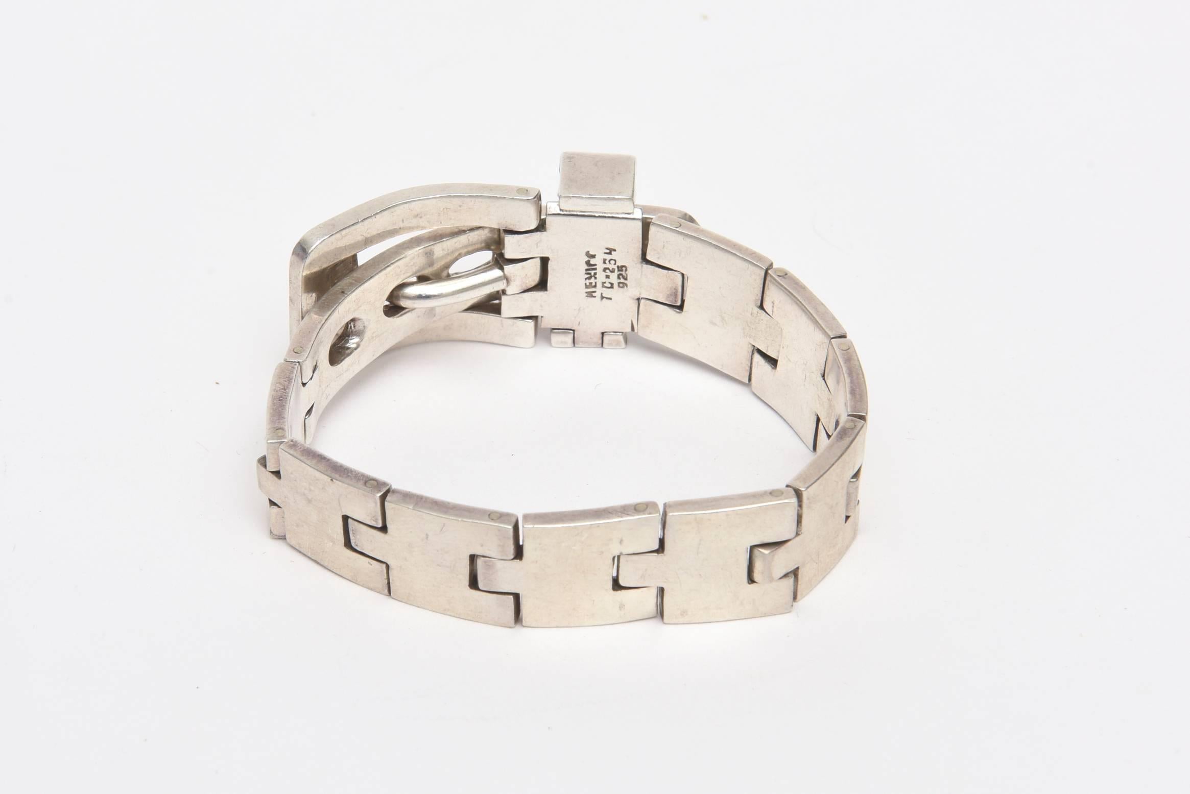 This vintage sterling silver buckle bracelet is marked Mexico and with numbers. It is marked TC-254 925. This is a classic bracelet that remains timeless! One can wear many buckle bracelets together as well or these can be paired with other types of