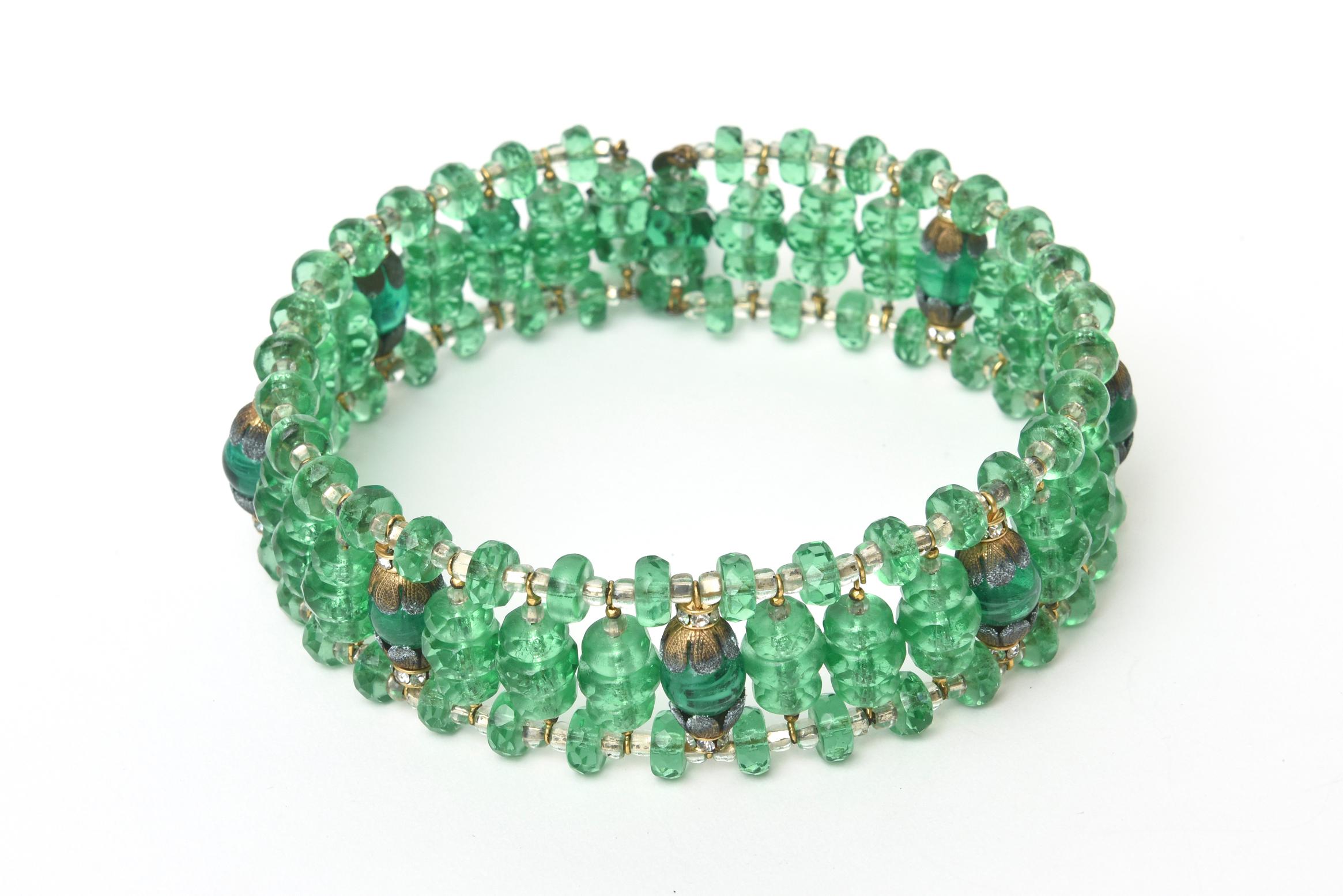 This stunning and amazing set of 2 signed Miriam Haskell mid century modern green glass beaded choler necklace and matching cluster dangle earrings is a gorgeous shade of rich emerald green jewel tone. They can be worn together or separately. Both
