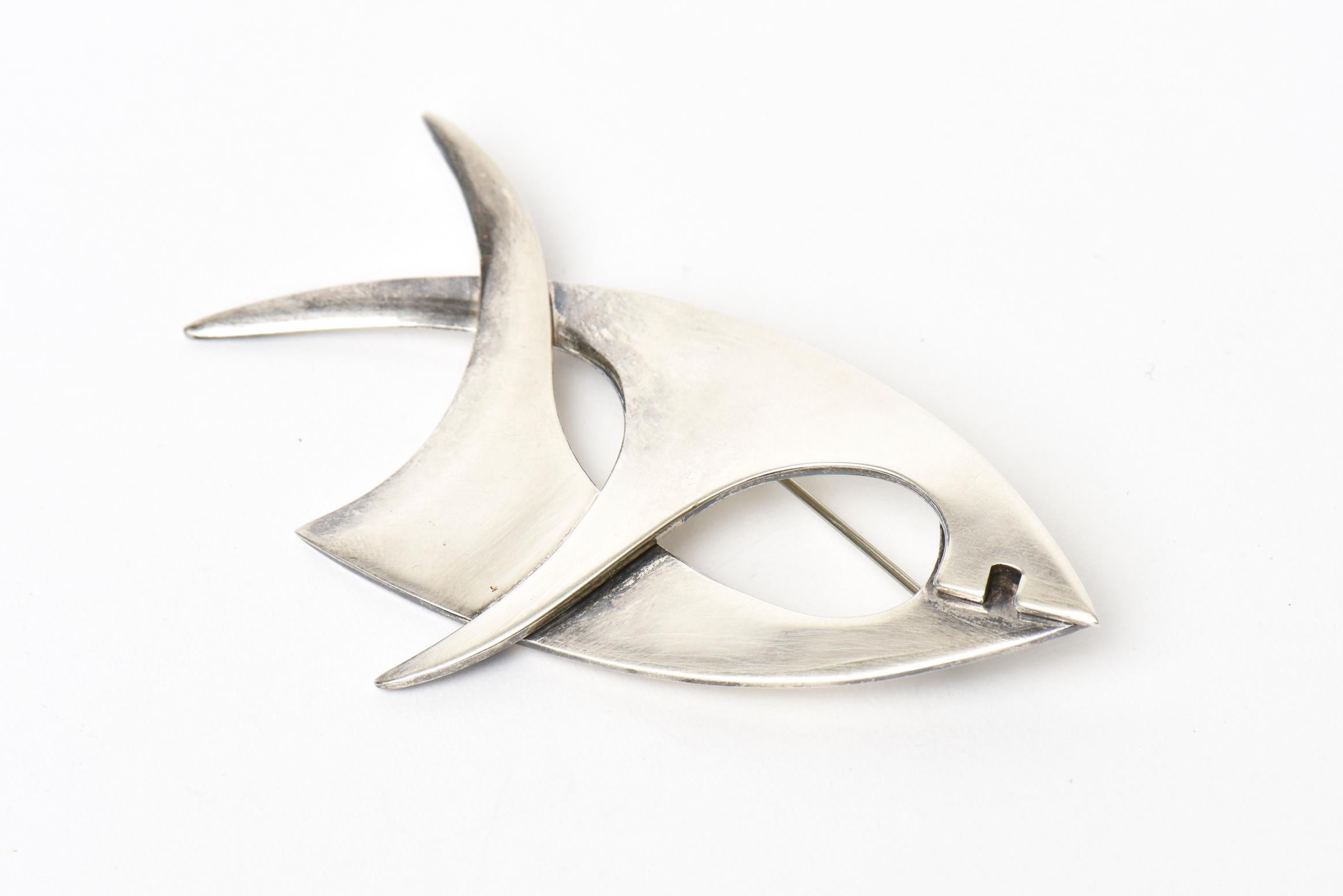 This wonderful vintage hallmarked abstract sterling silver signed  brooch/ pin by Sigi Pineda Is hallmarked TB-28 Mexico 925. It is from the 60's. it is a formation of a fish.