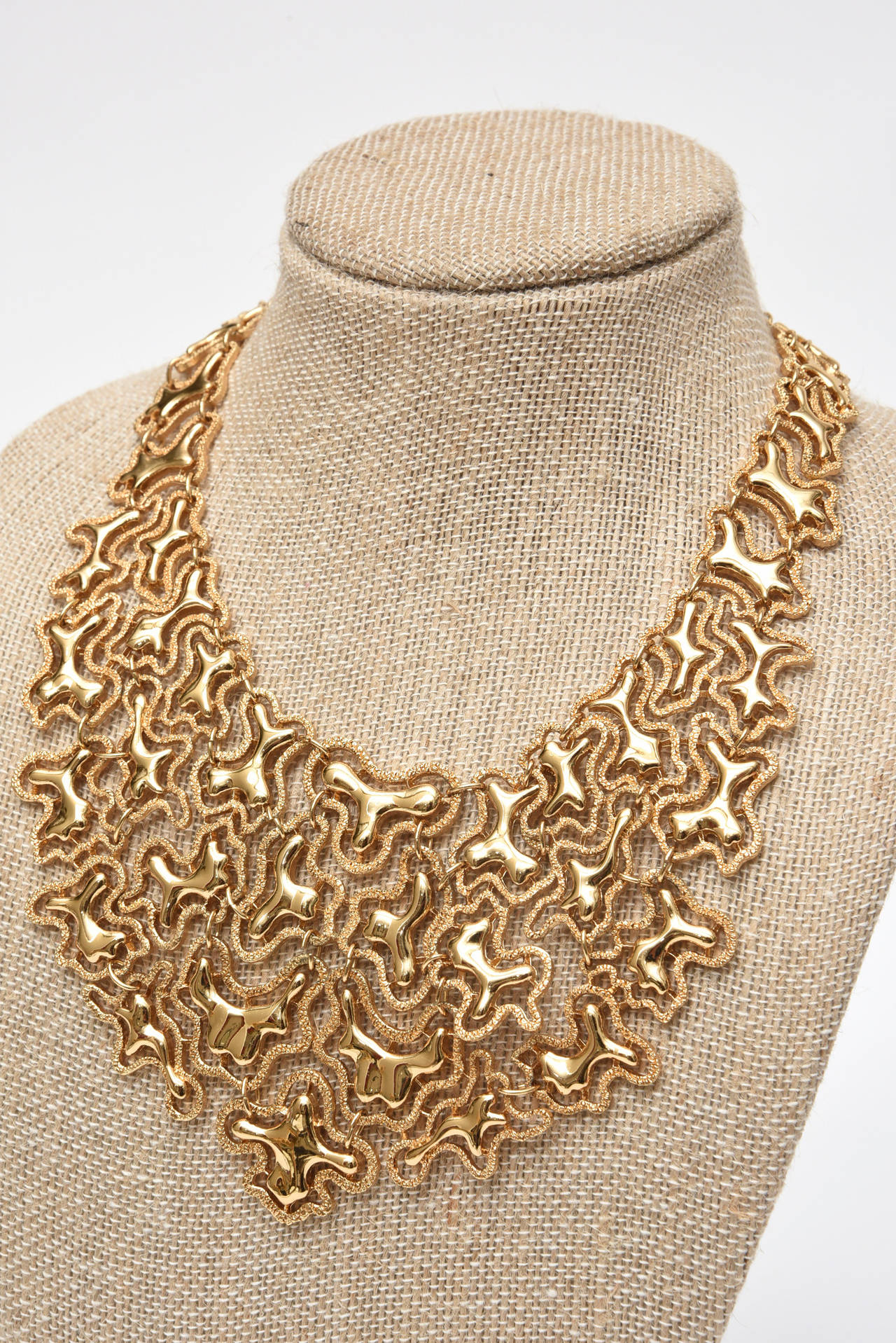 Monet Vintage Sculptural Gold Tone Bib Abstract Design Necklace In Good Condition For Sale In North Miami, FL