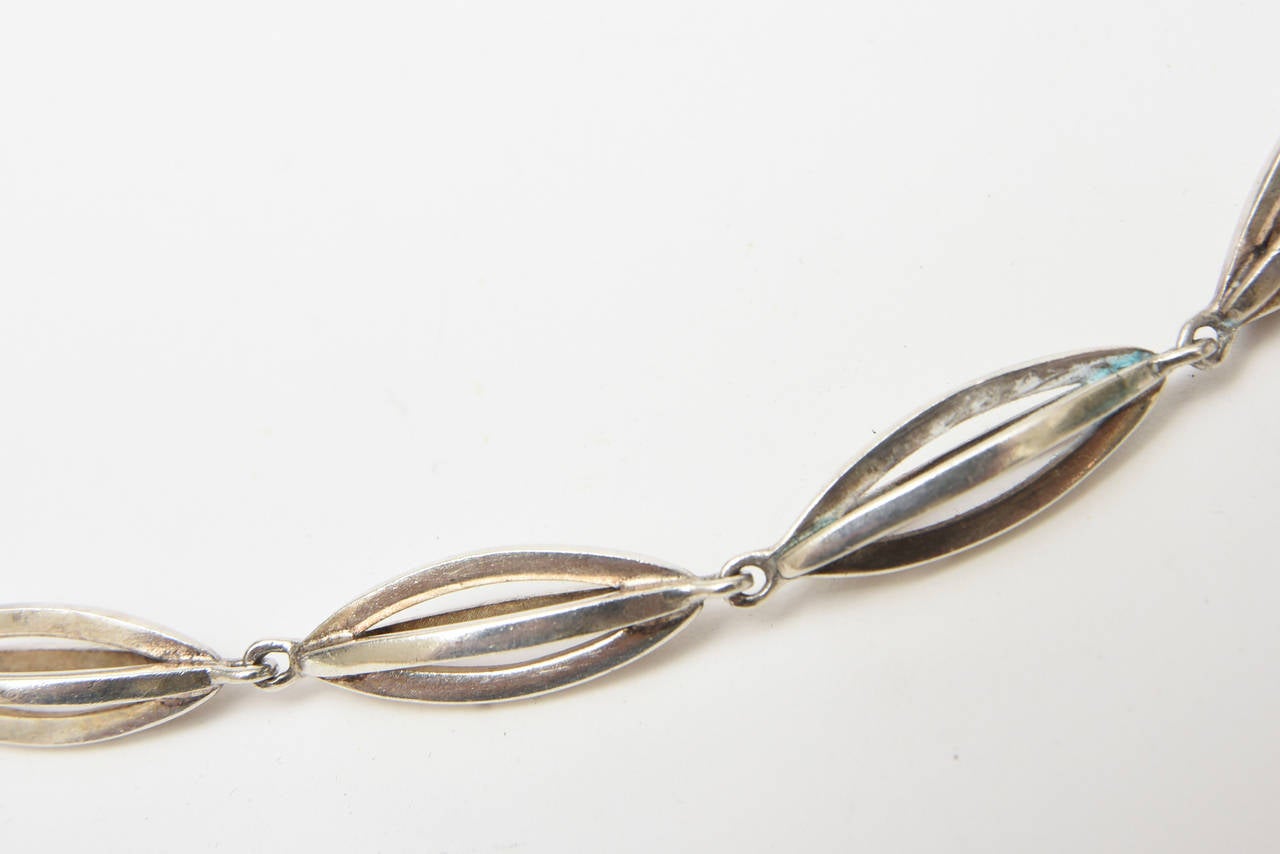 This signed stellar rare Gucci Italian sterling silver sculptural geometric necklace looks like almond pods linked together with open work. It is vintage and fabulous! This lovely sculptural sterling silver long necklace is signed Gucci and is