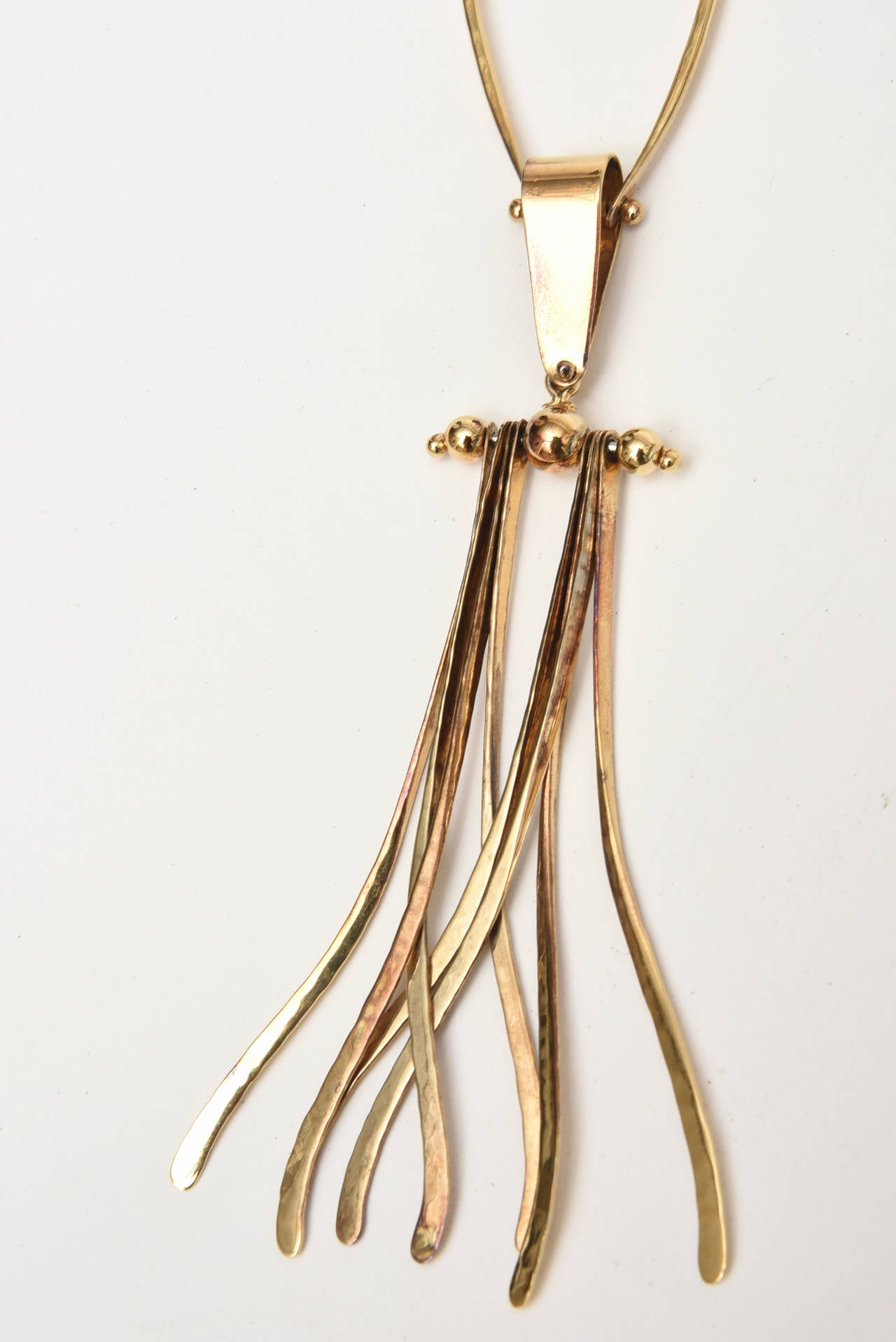 This fabulous one of kind sculptural hand wrought necklace is signed AijeWitt and marked 925 on the back where is meets the chain. It is so modernist. The length is long and this is finely made. It is gold wash over sterling silver. Artisan made.
