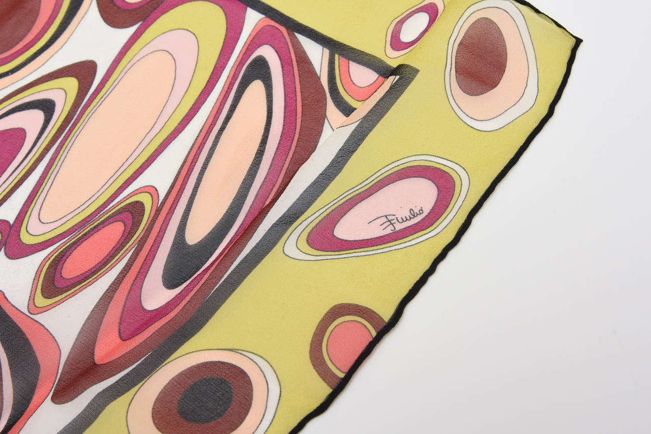 This beautiful array of luscious colors make up this rectangle vintage Italian Emilio Pucci abstract silk scarf. The colors include tones of blush pink, light pink, chartreuse, pink magenta, coral pink, brown and black. The oblong shape and size is