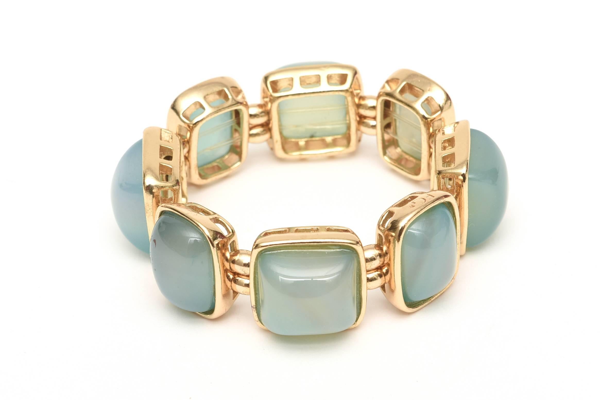 This beautiful bracelet and earrings set is of the blue/turquoise family of chalcedony that is said to have spiritual and healing properties. The color is of the Mediterrean Sea. The stones/agate are of the cabochon form .
It is serene and