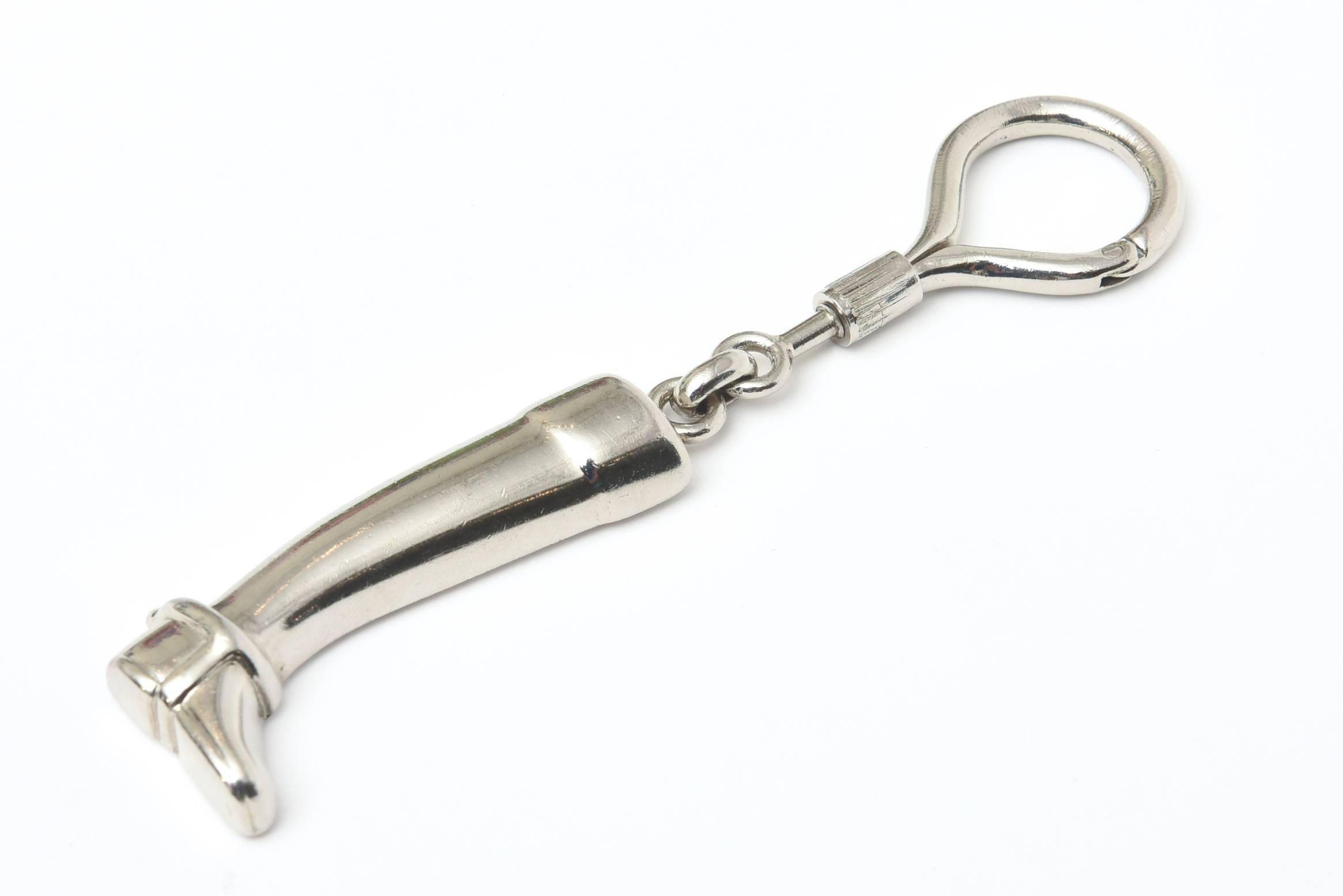 For all the Gucci lovers and horse lovers of the world... here is a great riding boot key chain in the shape of a stirrup. Masculine or feminine...
It says Gucci then Italy on the second line.
It is 4.85