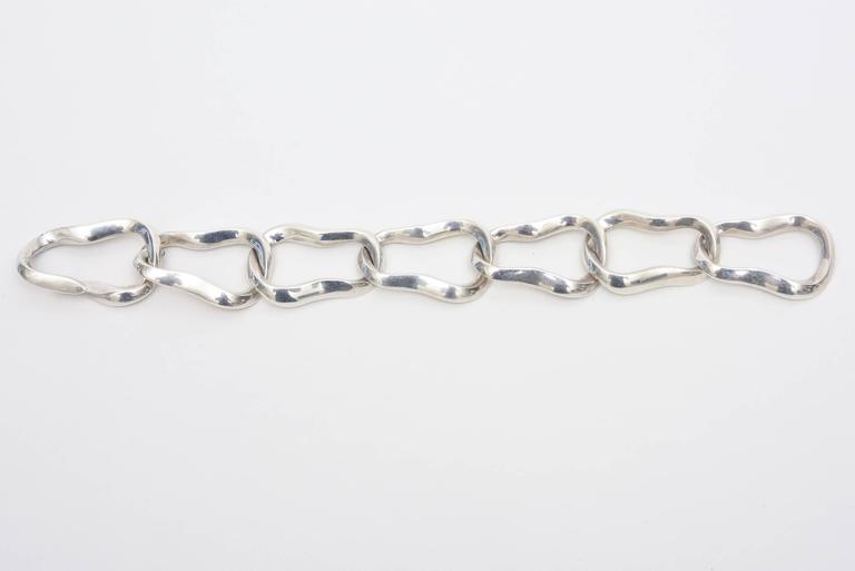 This stunning and sculptural sterling silver hallmarked Angela Cummings for Tiffany link bracelet is hard to come by now and more on the rare side. Tiffany no longer produces these bracelets now for a long time. It is signed copyright 1986 Cummings