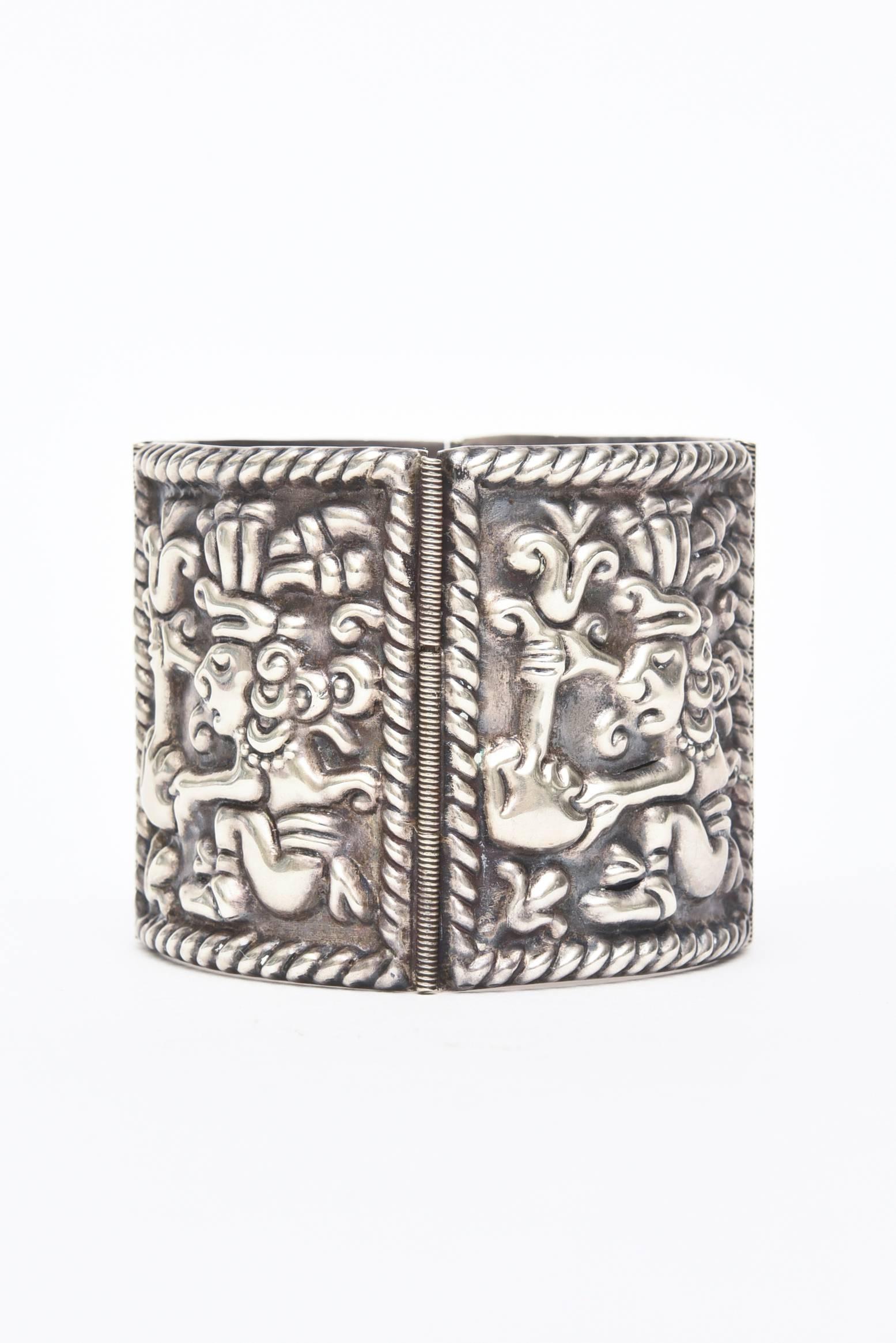 This symbolic sterling silver cuff bracelet is signed with lots of hallmarks. It is hallmarked Hencho en Mexico 0925 with initials and symbols. This is an early piece from the 40's or early 50's.
It fits beautifully on the wrist... not heavy not