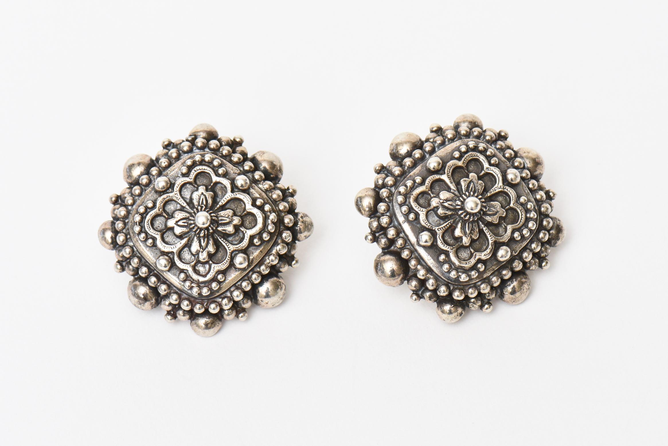 This lovely, signed and early Stephen Dweck sterling silver earrings have some great weight. They have a revival renaissance meets baroque design meets byzantine. They are stamped Stephen Dweck 1991 @ Stephen Dweck 