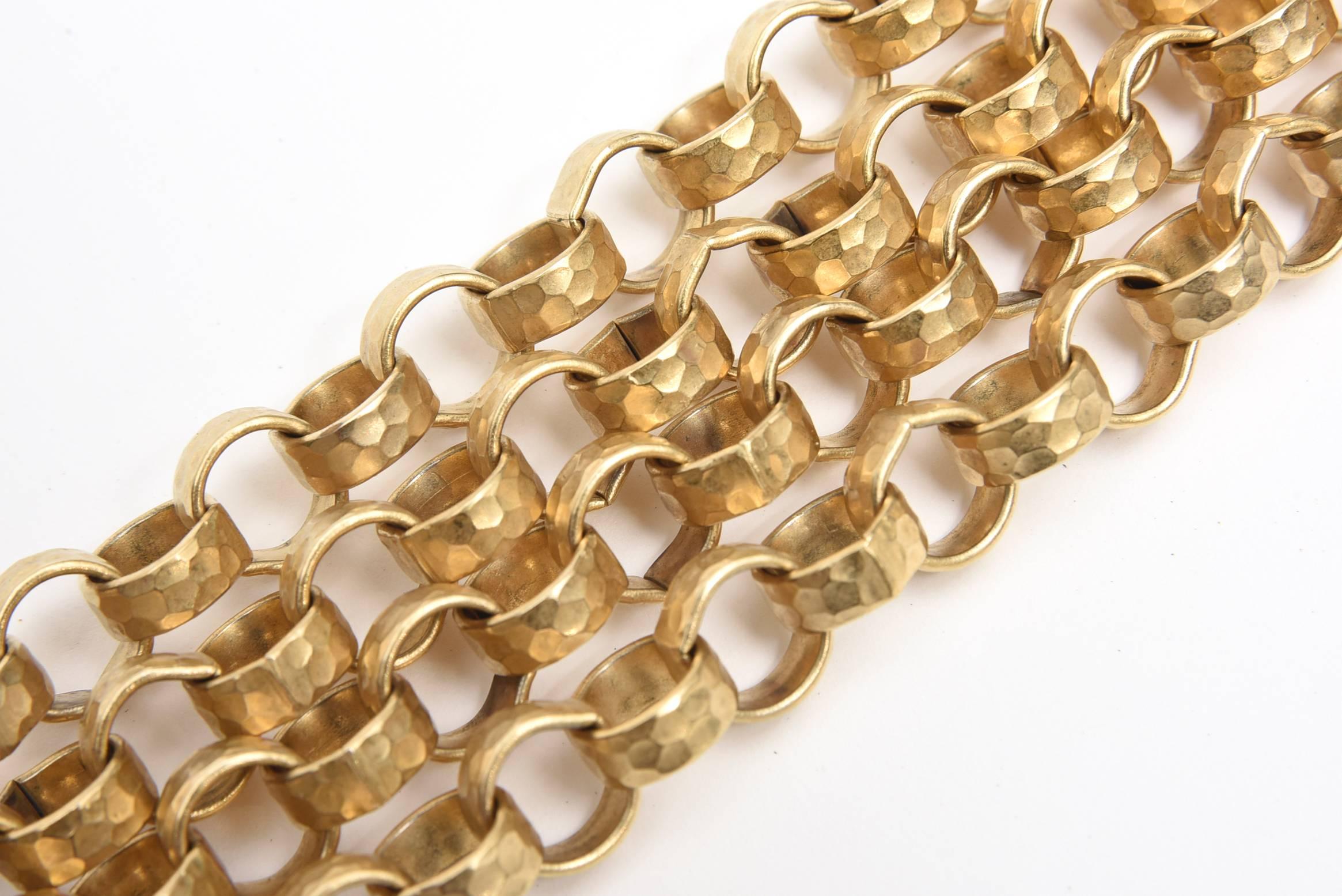 This fabulous vintage Givenchy hand hammered gold plated 4 row chain link bracelet is fantastic. This process goes back to the Egyptians. The closure is a pin lock that pulls out and in. It has a Givenchy tag and is unusual and in mint condition. It