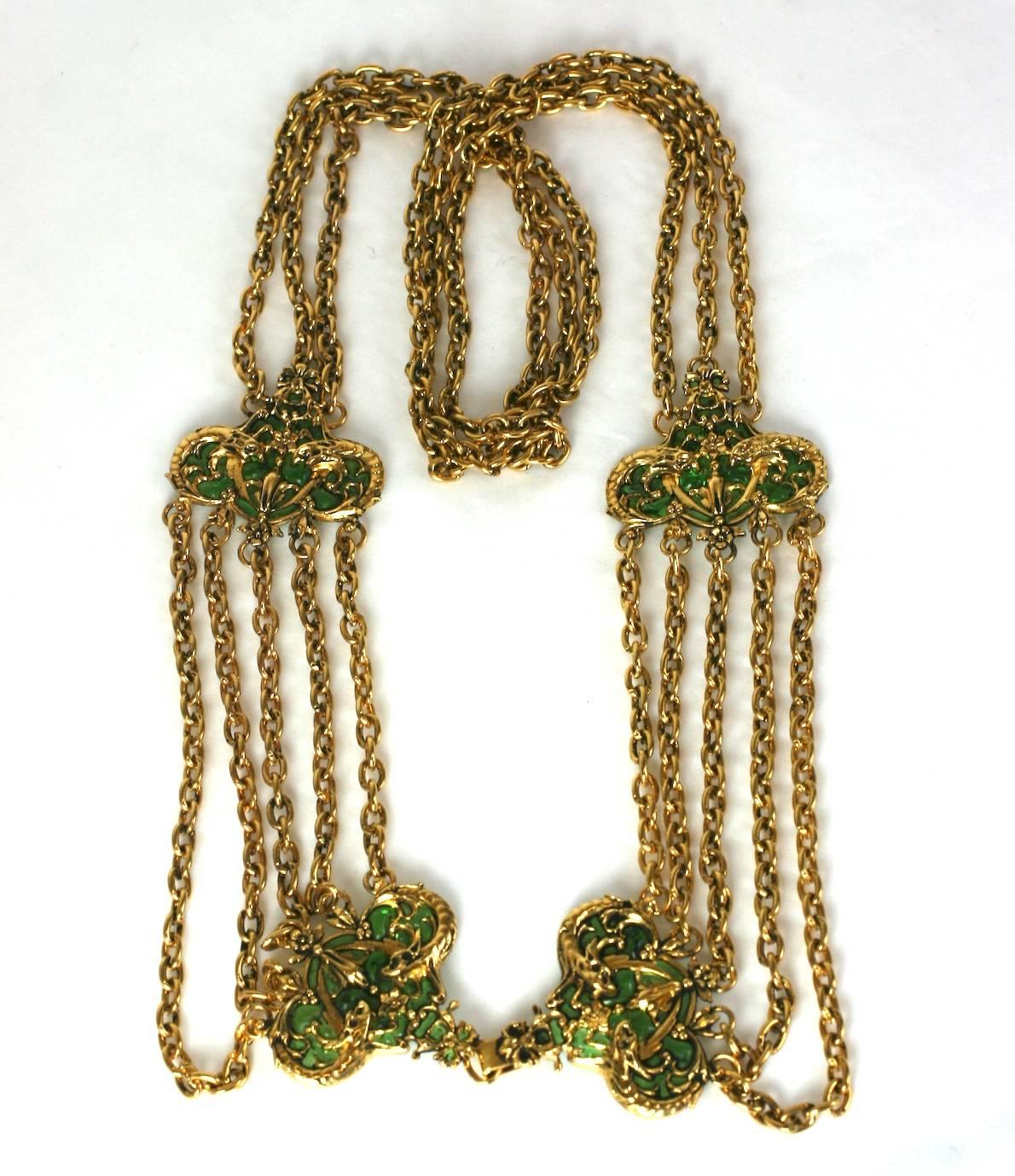 Coco Chanel Early Poured Glass Haute Couture Belt. Designed as a series of swag chains with emerald poured glass stations. Classically Baroque in the Chanel idiom with sea serpent motifs highlghted by the emerald poured glass settings. Maison R.